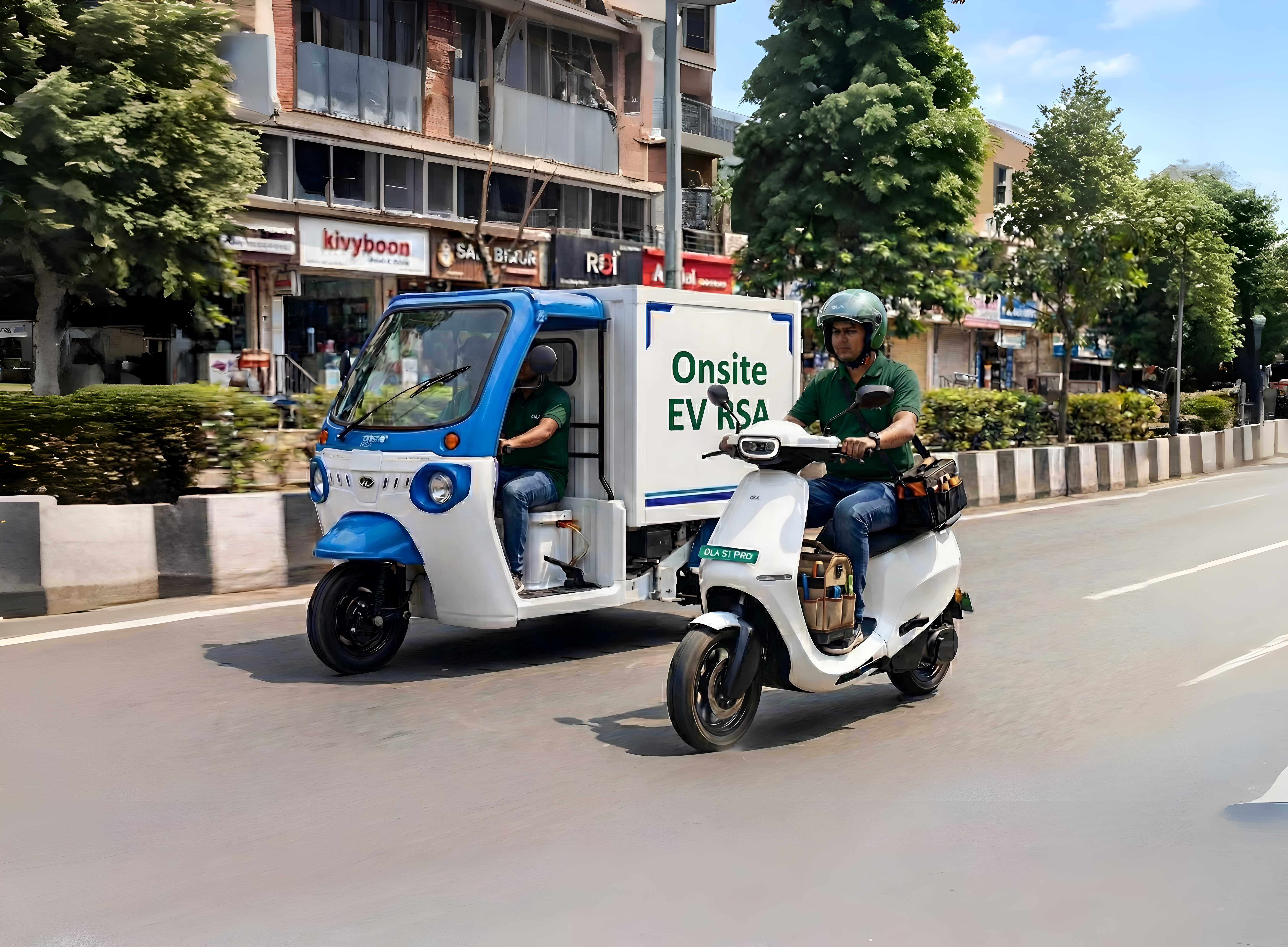 Battwheels onsite EV roadside assistance - technician on scooter with service vehicle