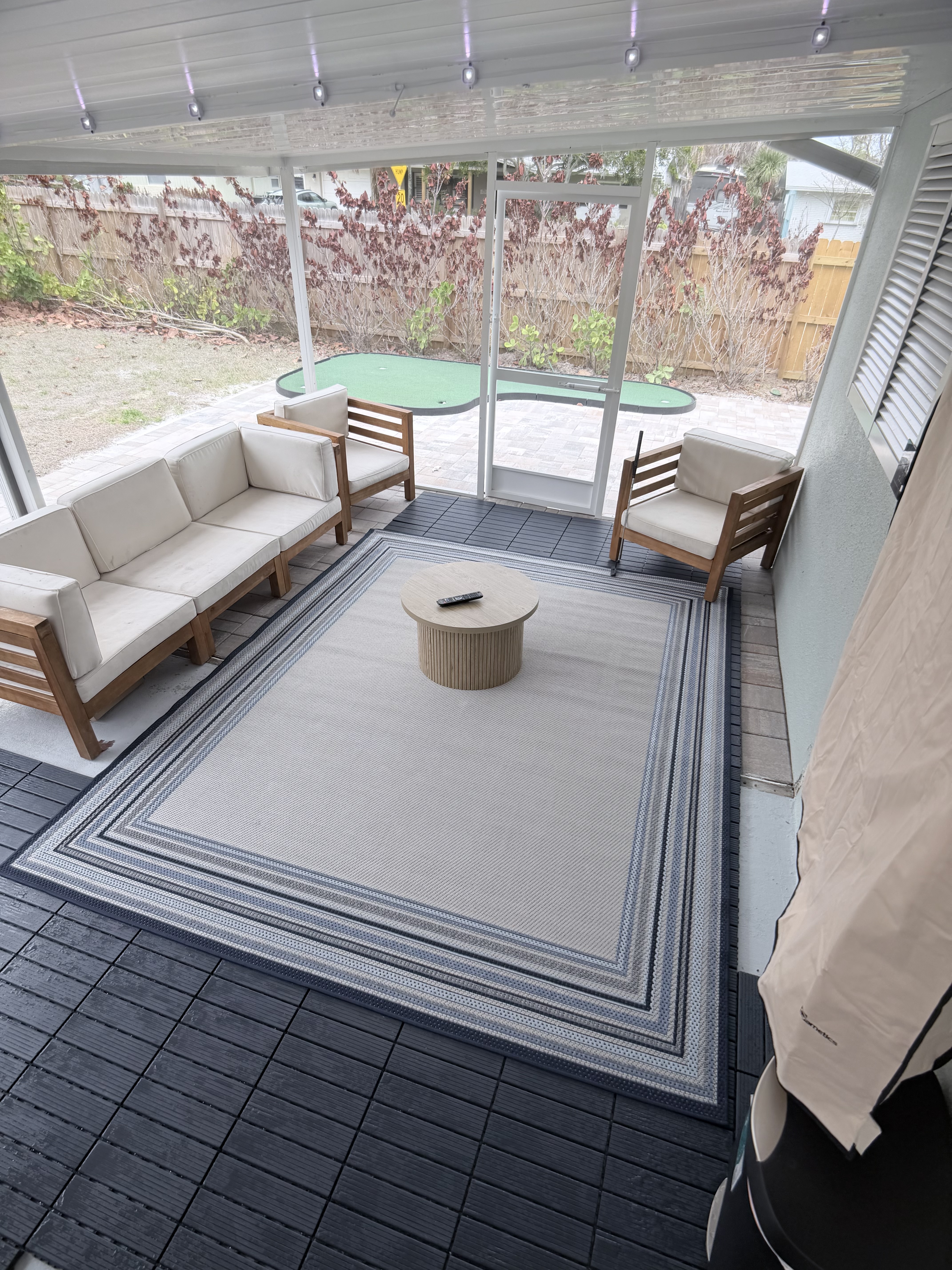 Bright screened lounge with view to backyard