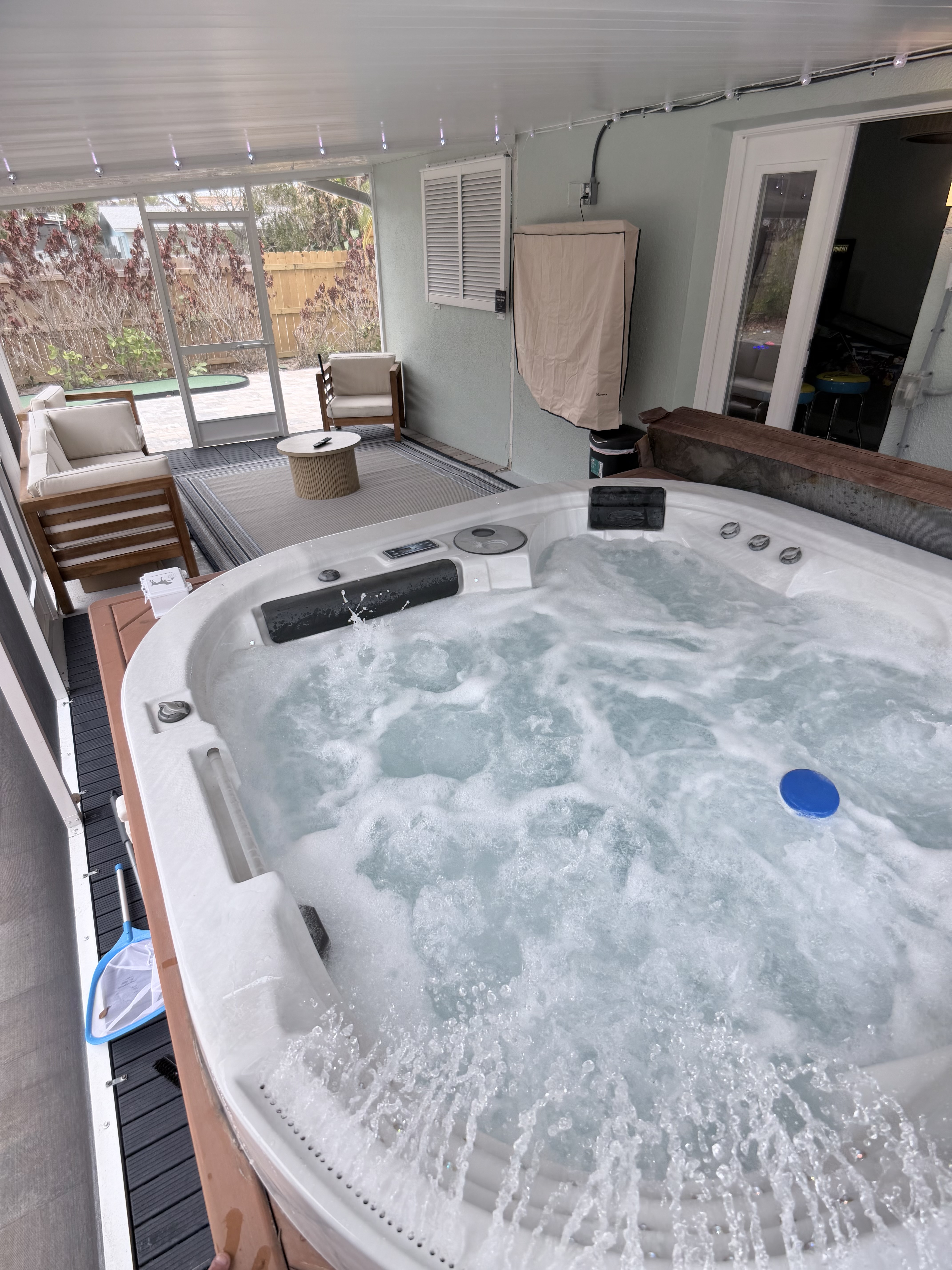 Private hot tub on screened patio