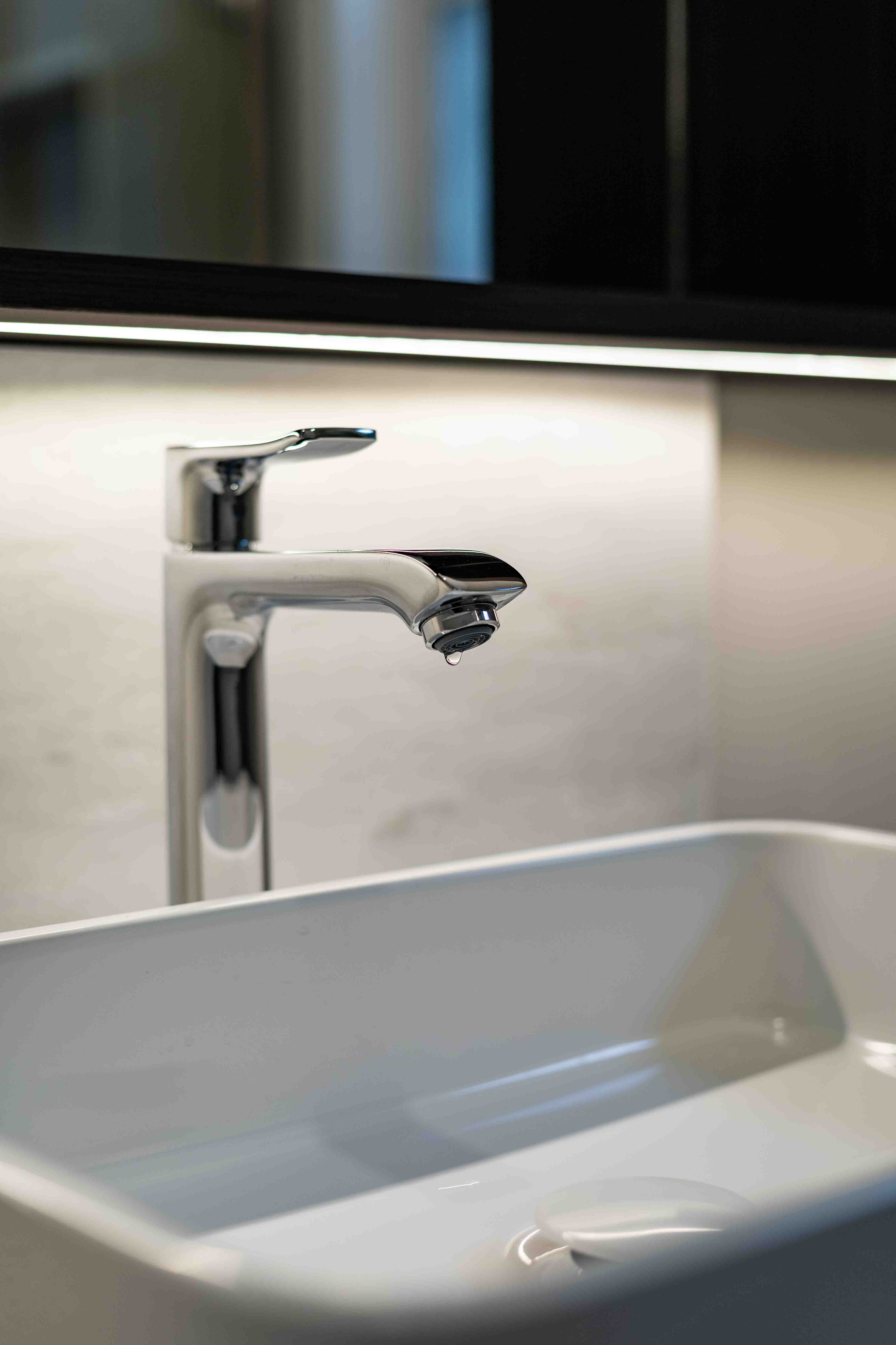 Modern bathroom sink and chrome waterfall faucet detail — Vancouver Designer Kitchen project