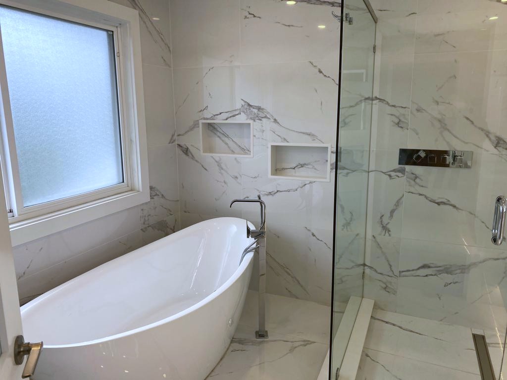 Vancouver spa bathroom renovation with freestanding soaker tub, glass shower and Calacatta marble