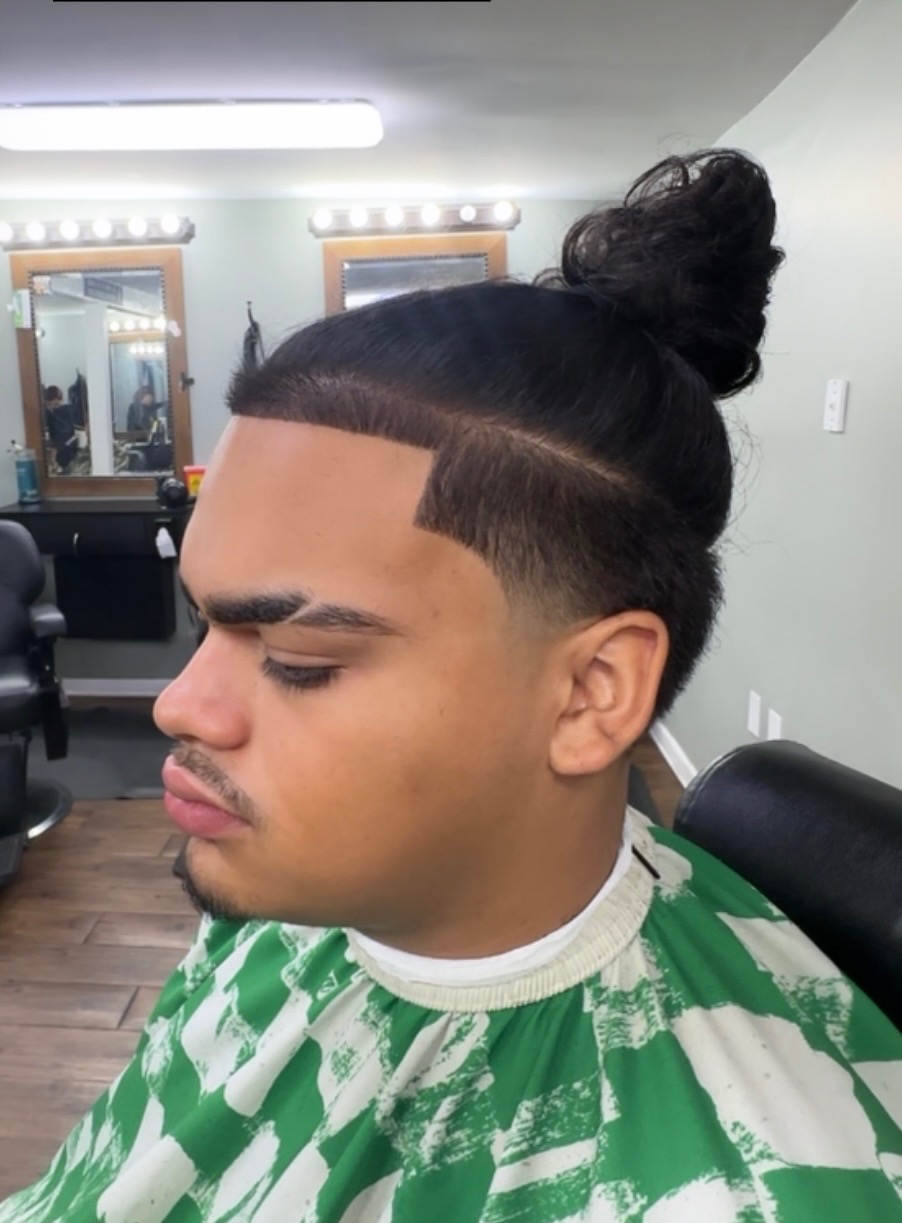 Man bun with sharp line-up