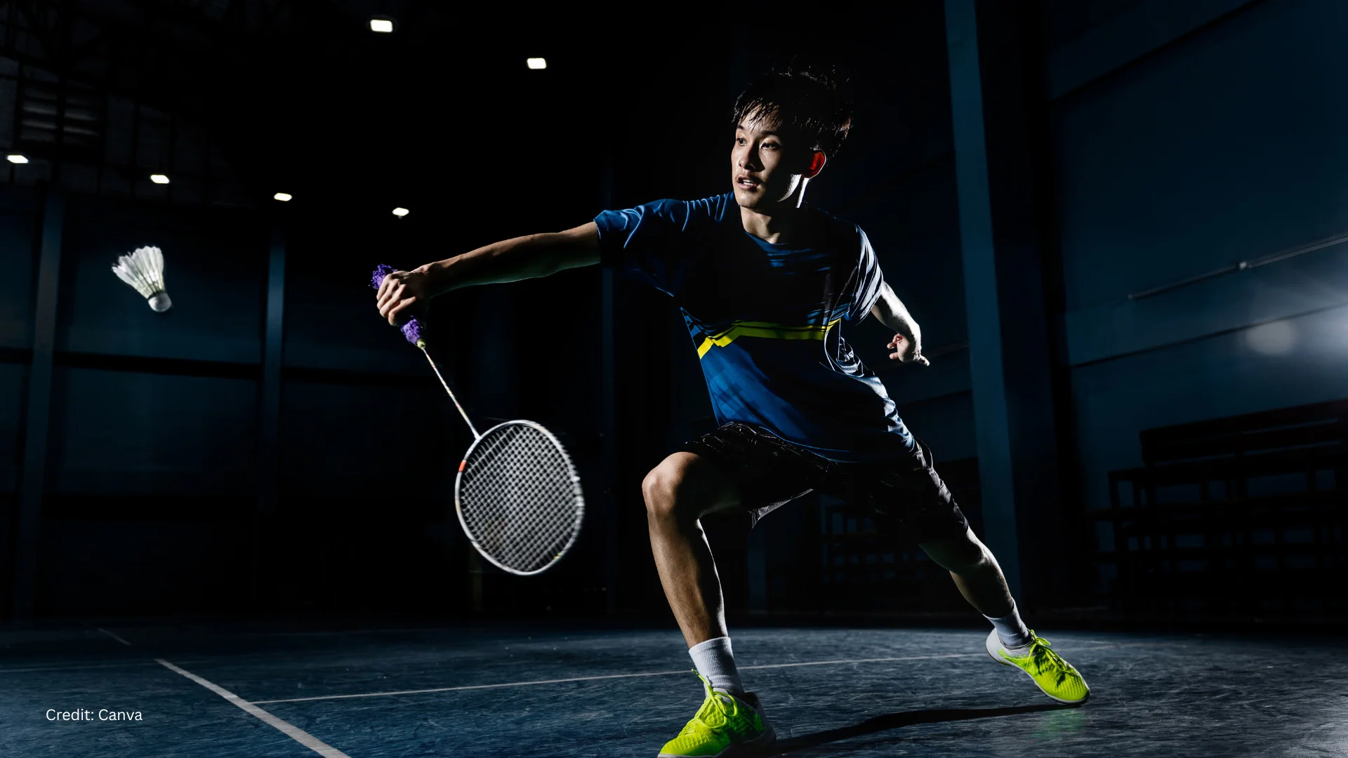 Badminton player performing a smash shot during competitive match - track your badminton stats and improve