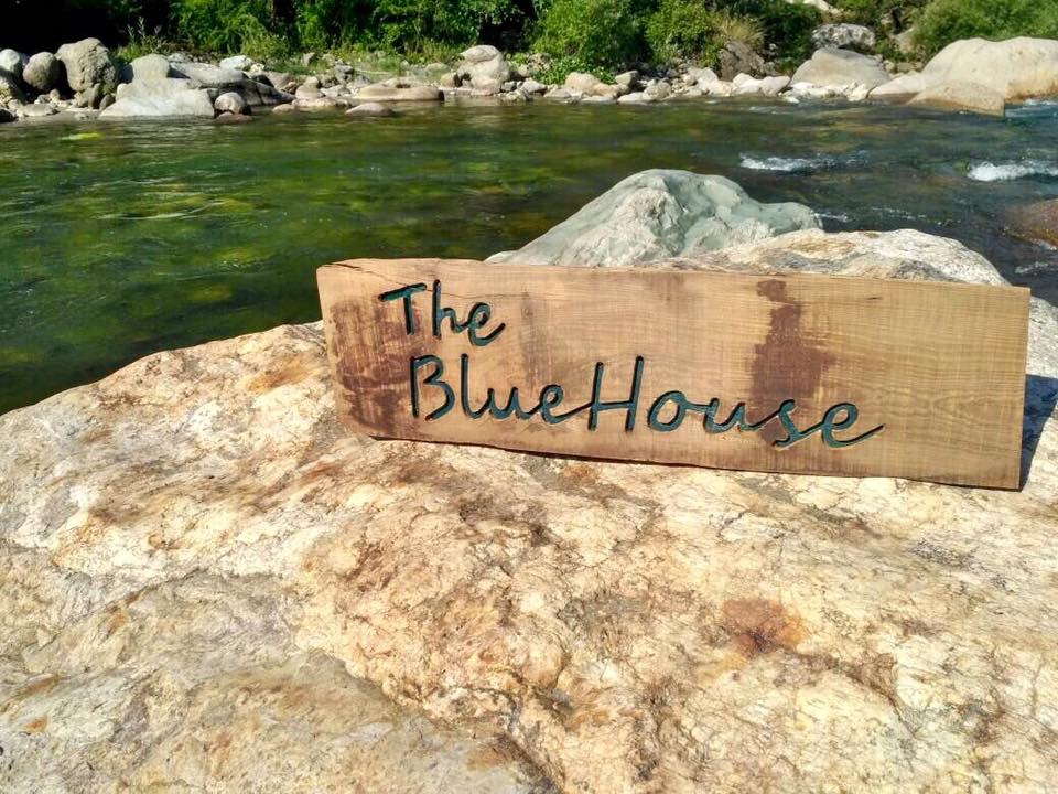The Bluehouse Sign by River