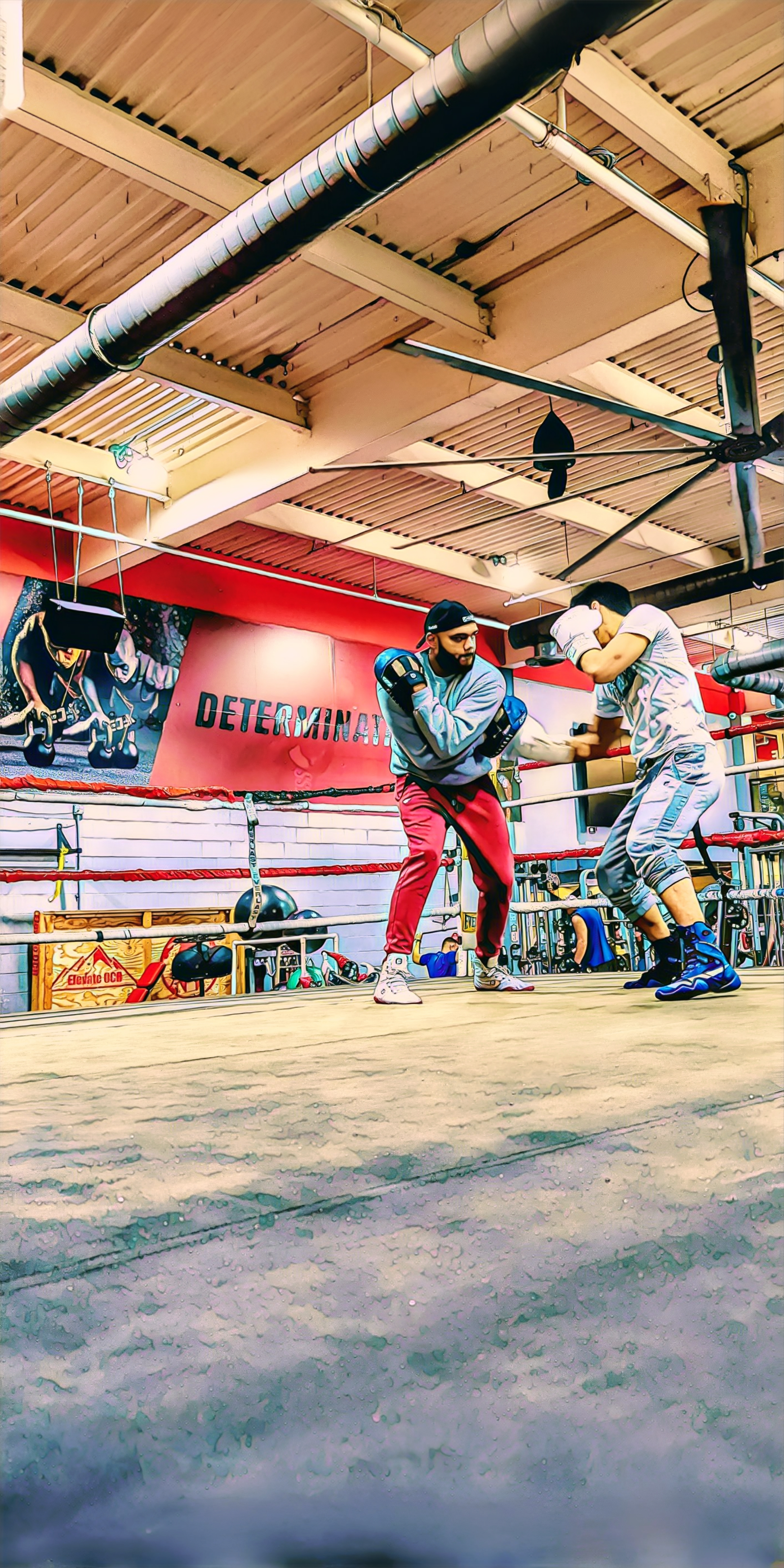 Coach Chris training a fighter in the ring