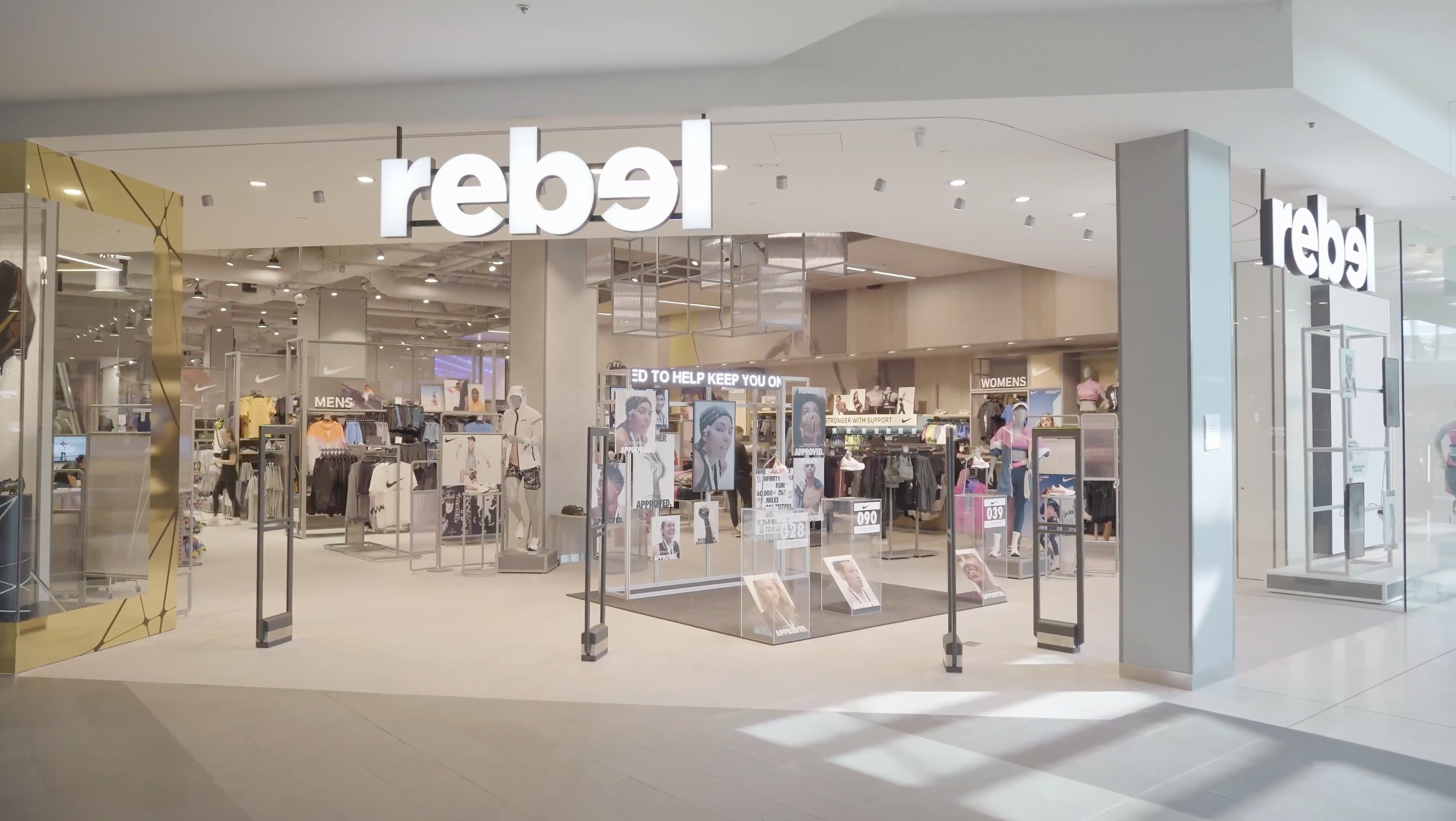 rebel storefront — flagship shopfront and lightbox signage from the RCX (rebel Customer Experience) format led by Lisa Doban as Head of Visual Merchandising