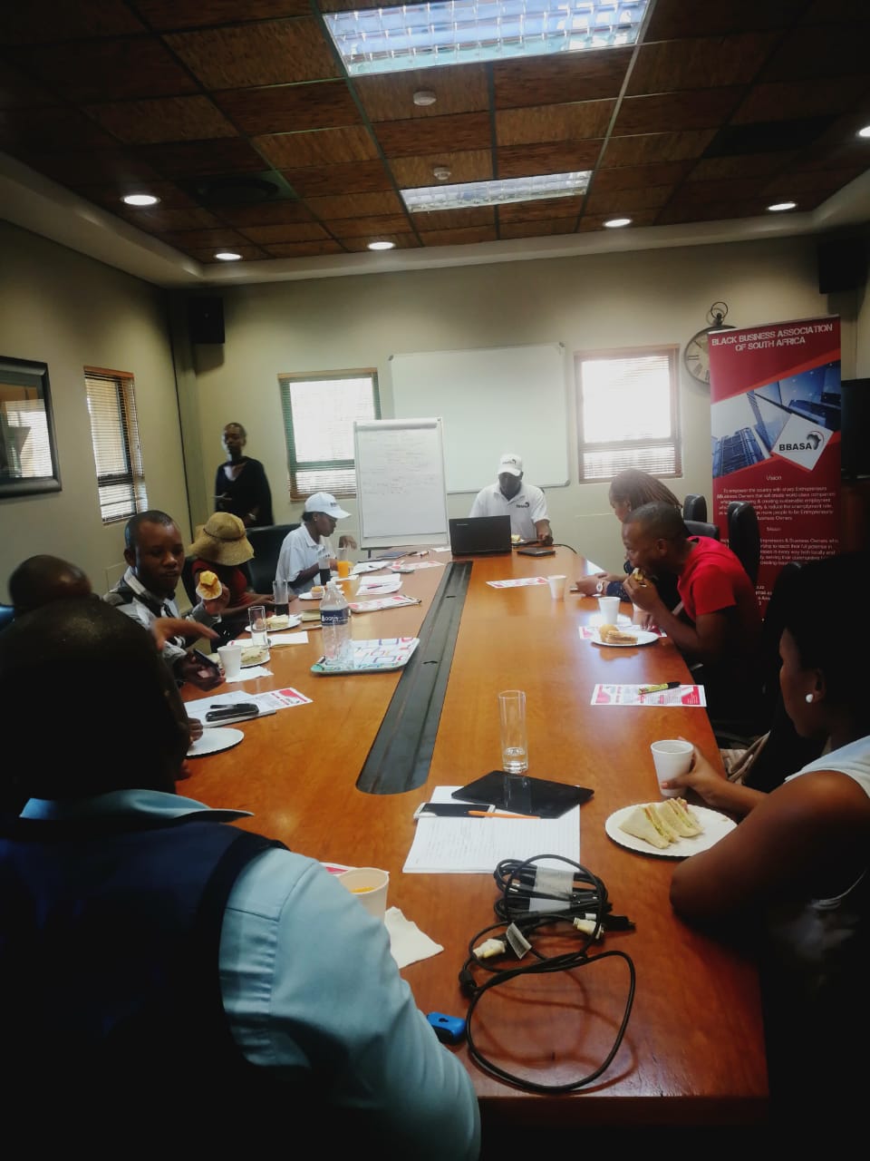 BBASA boardroom briefing at member offices — networking over breakfast.