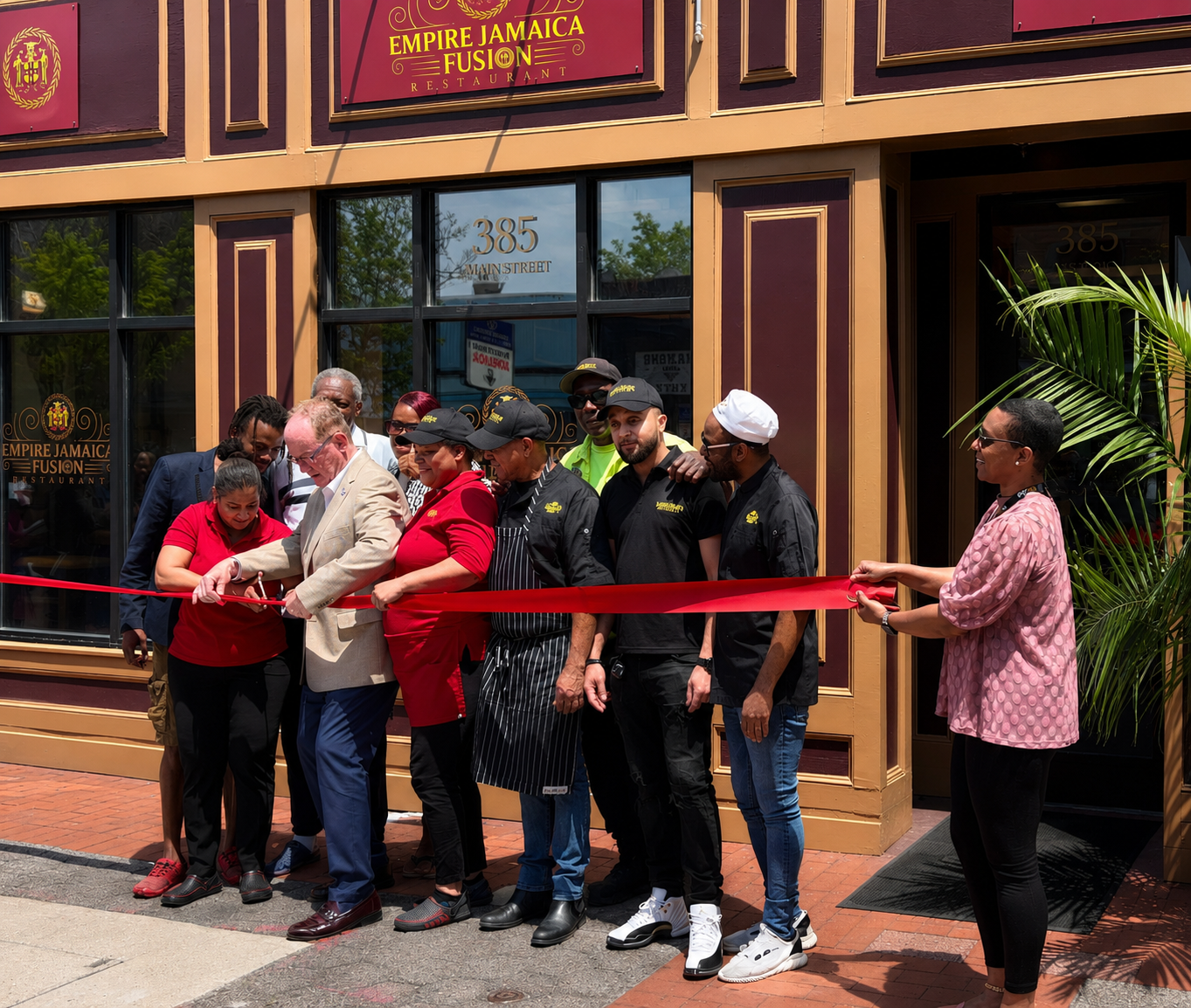 Empire Jamaica Fusion ribbon-cutting ceremony at 385 Main Street, Poughkeepsie — Michelle Gibson with team and community members