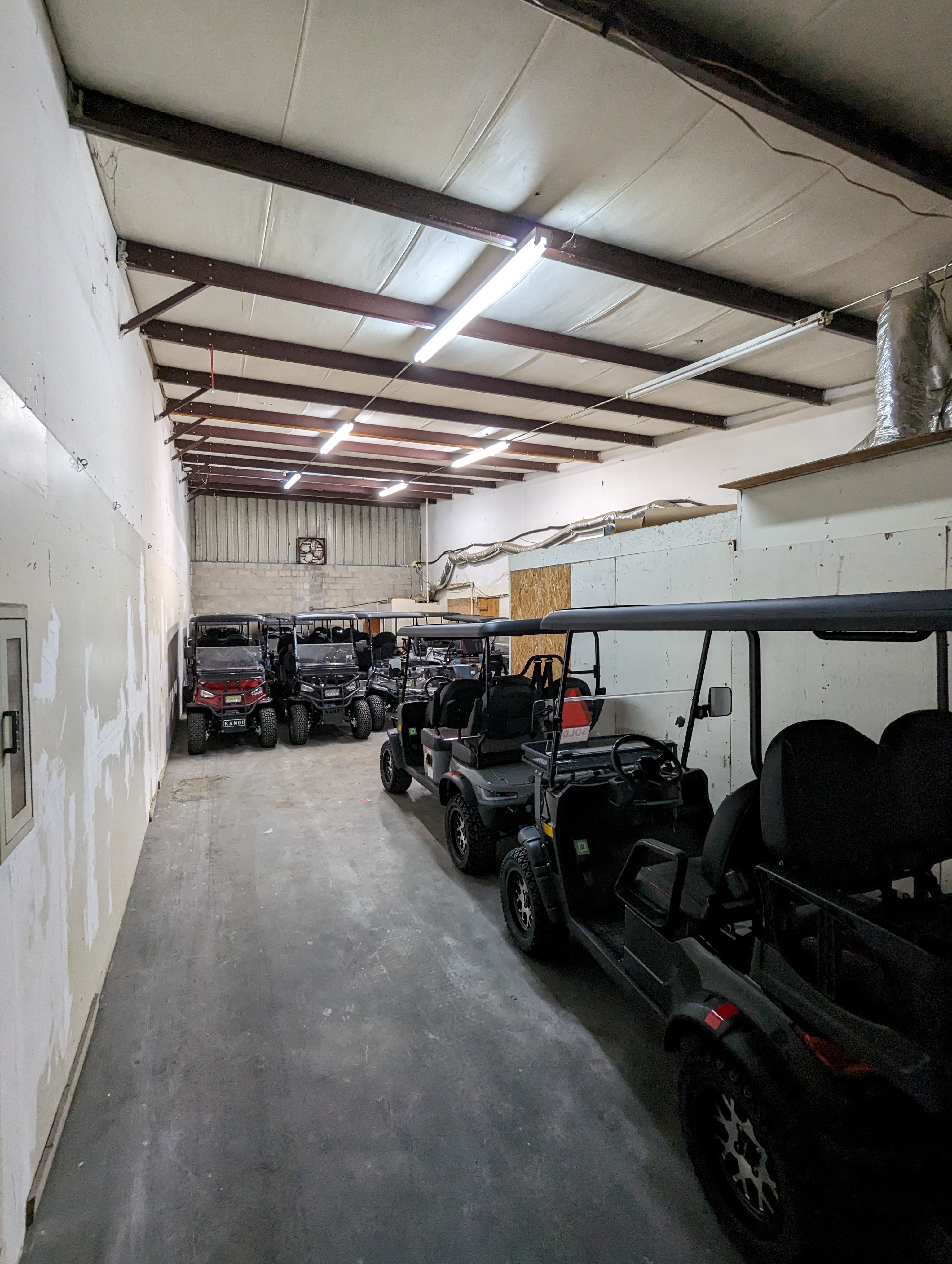 The first rented unit at Jake's Custom Carts in late 2023 / early 2024 — the original 9 carts inside a small leased bay