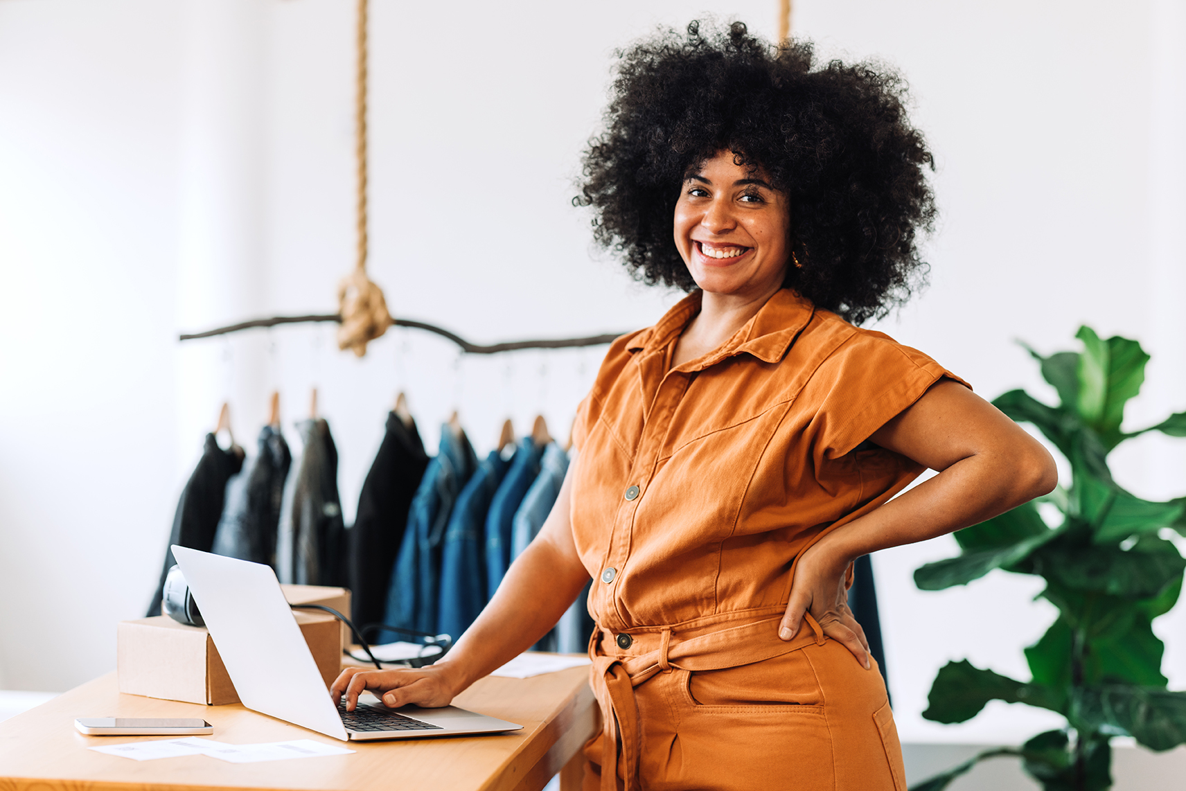 Happy small business owner at her workspace