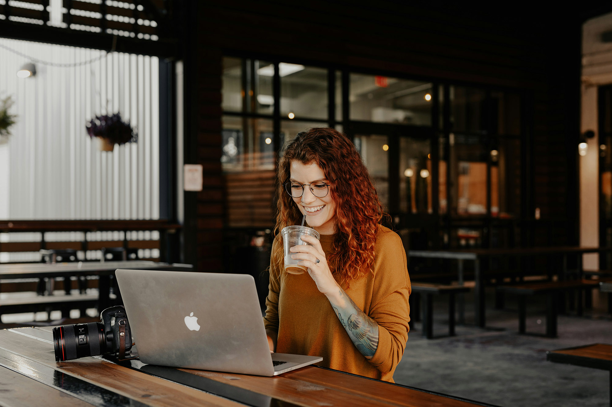 Solopreneur photographer working at her laptop