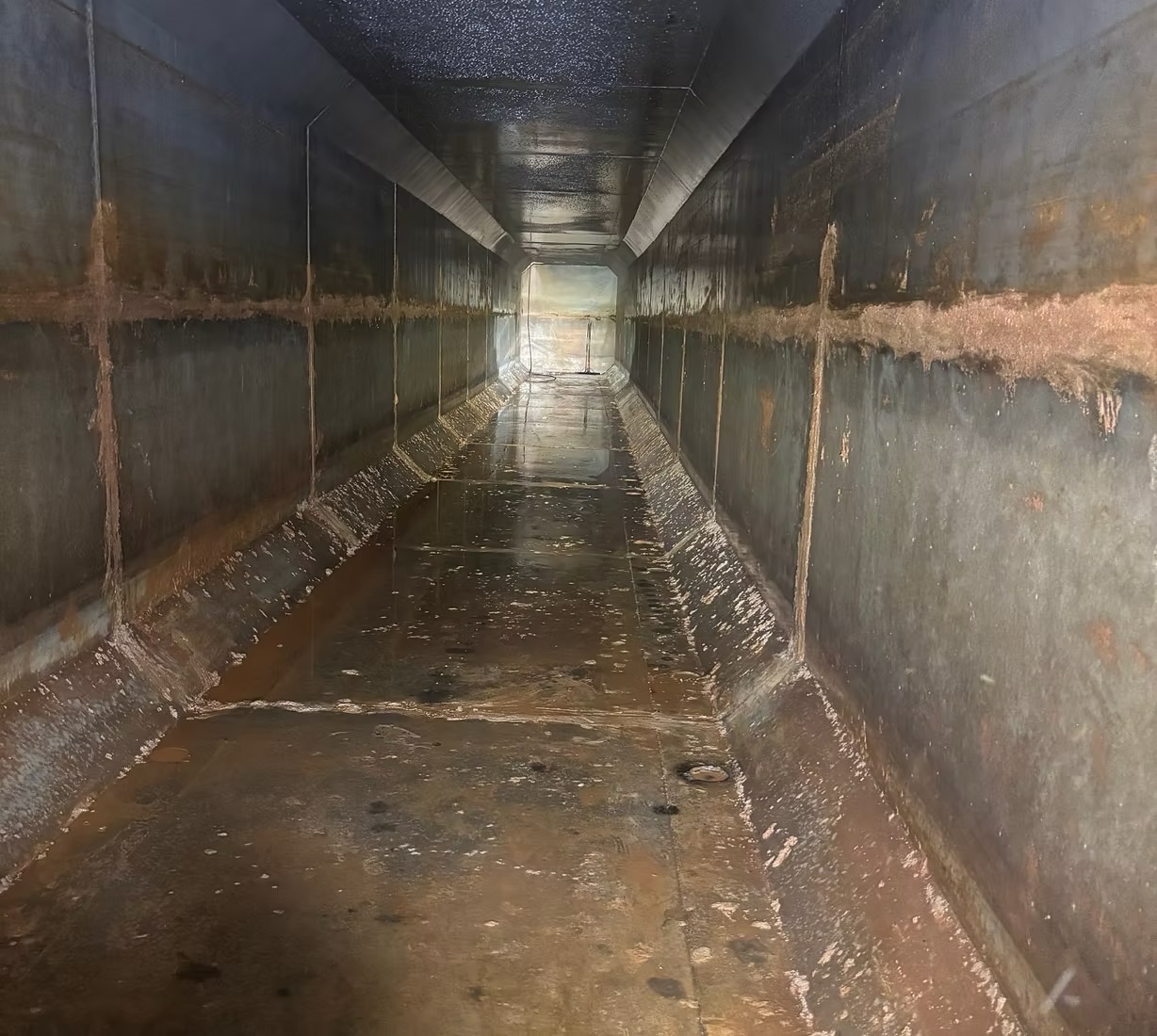 Inside view of underground detention system during cleaning