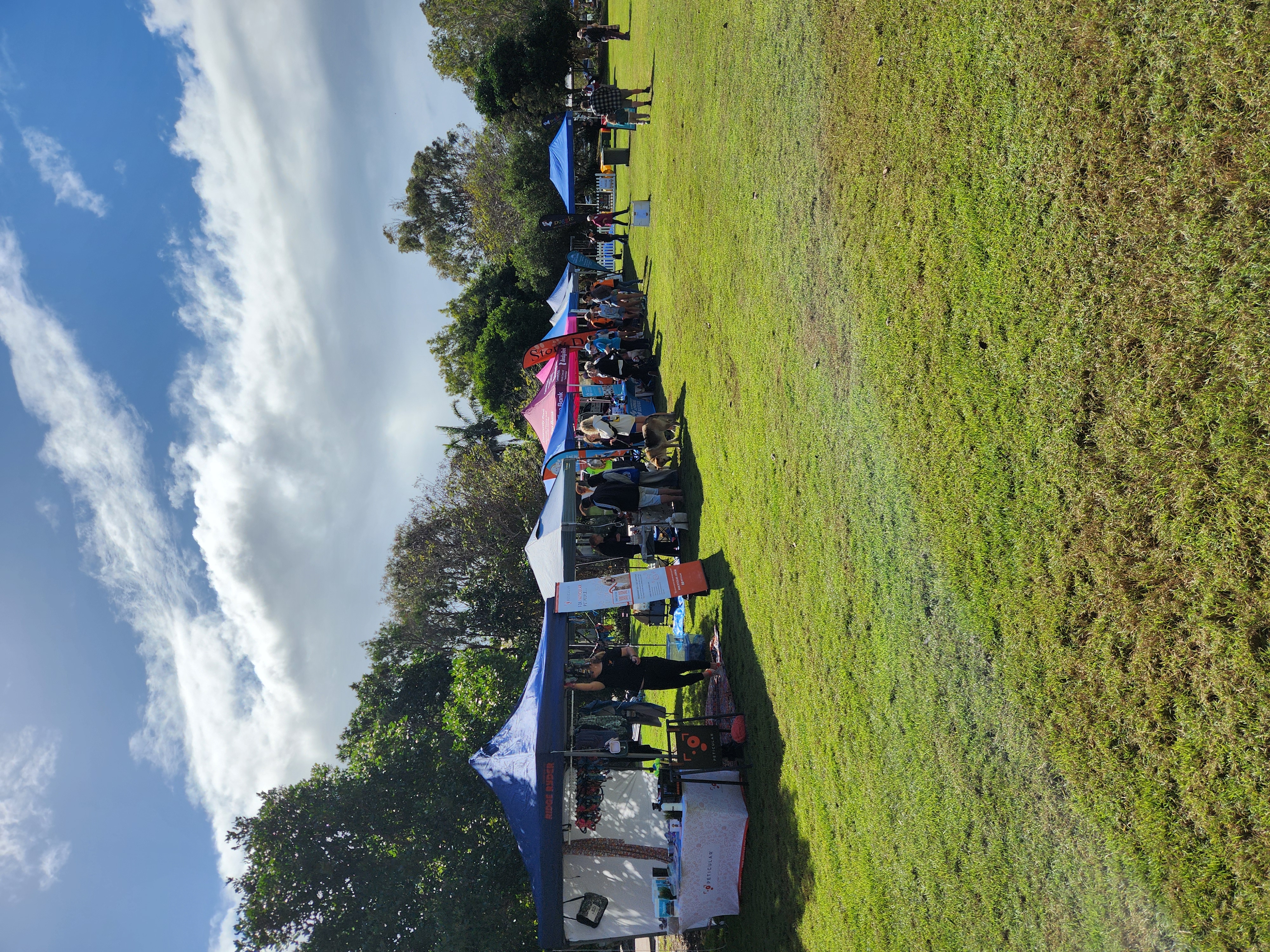 Vendor tents and community stalls at Paws in the Park 2025