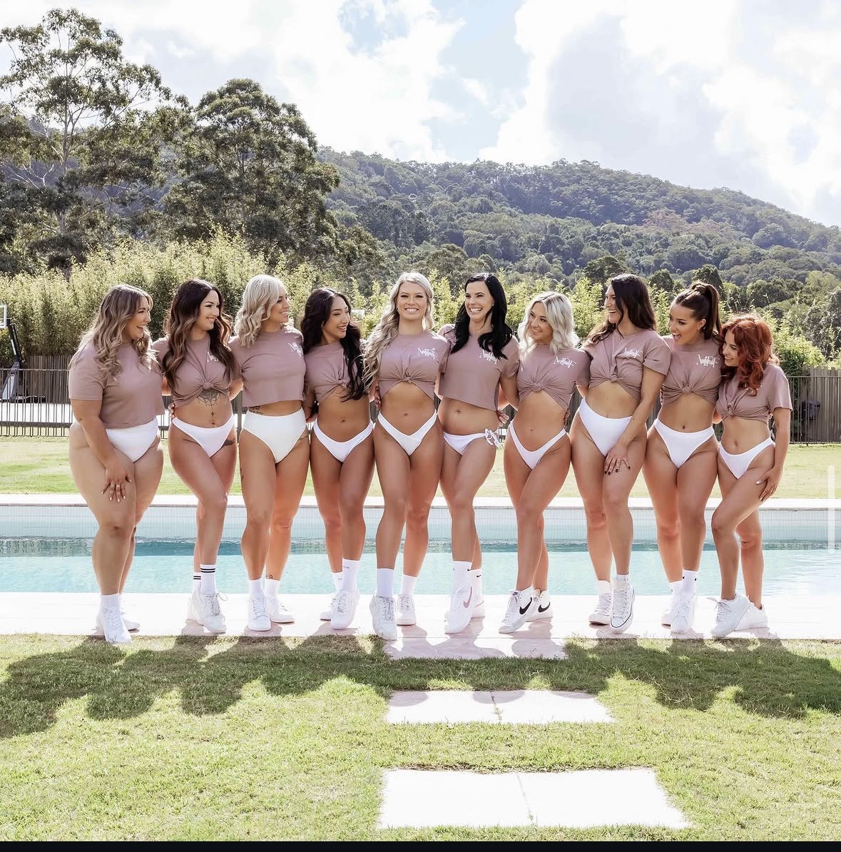 EmpowerME women — together by the pool after their empowerment shoot