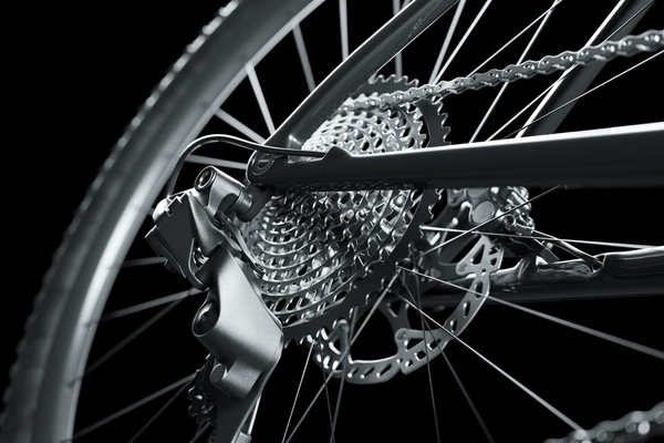 Close-up of a bicycle rear cassette, derailleur and chain