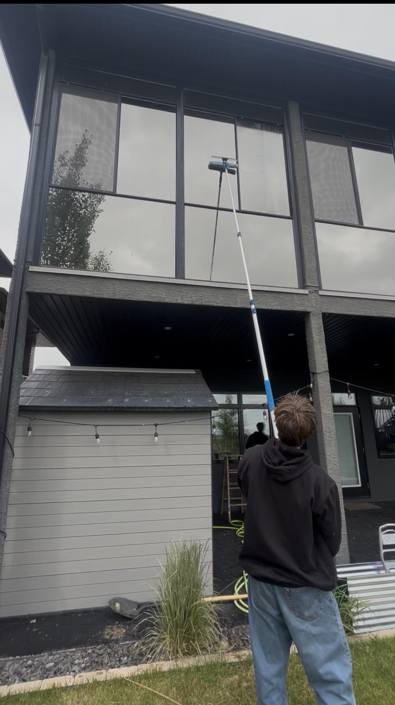 StreetView Exterior Services worker cleaning windows