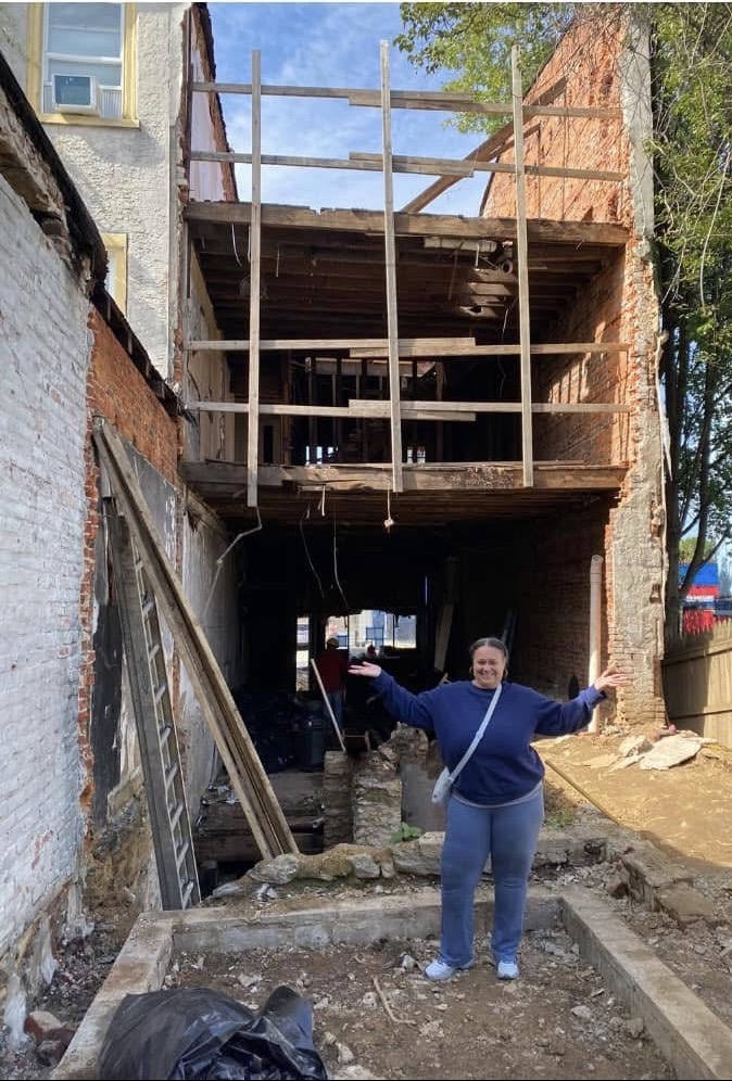 Anissa surveying a property at the start of a rehabilitation project