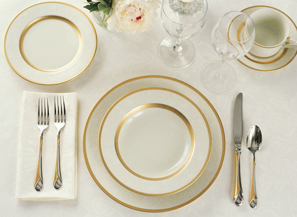 Elegant knife resting on bread plate with napkin
