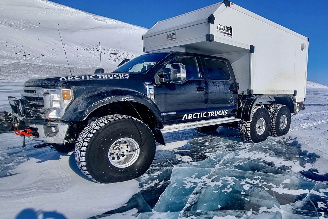 Arctic Trucks AT44 with Total Composites habitat on cracked Arctic ice