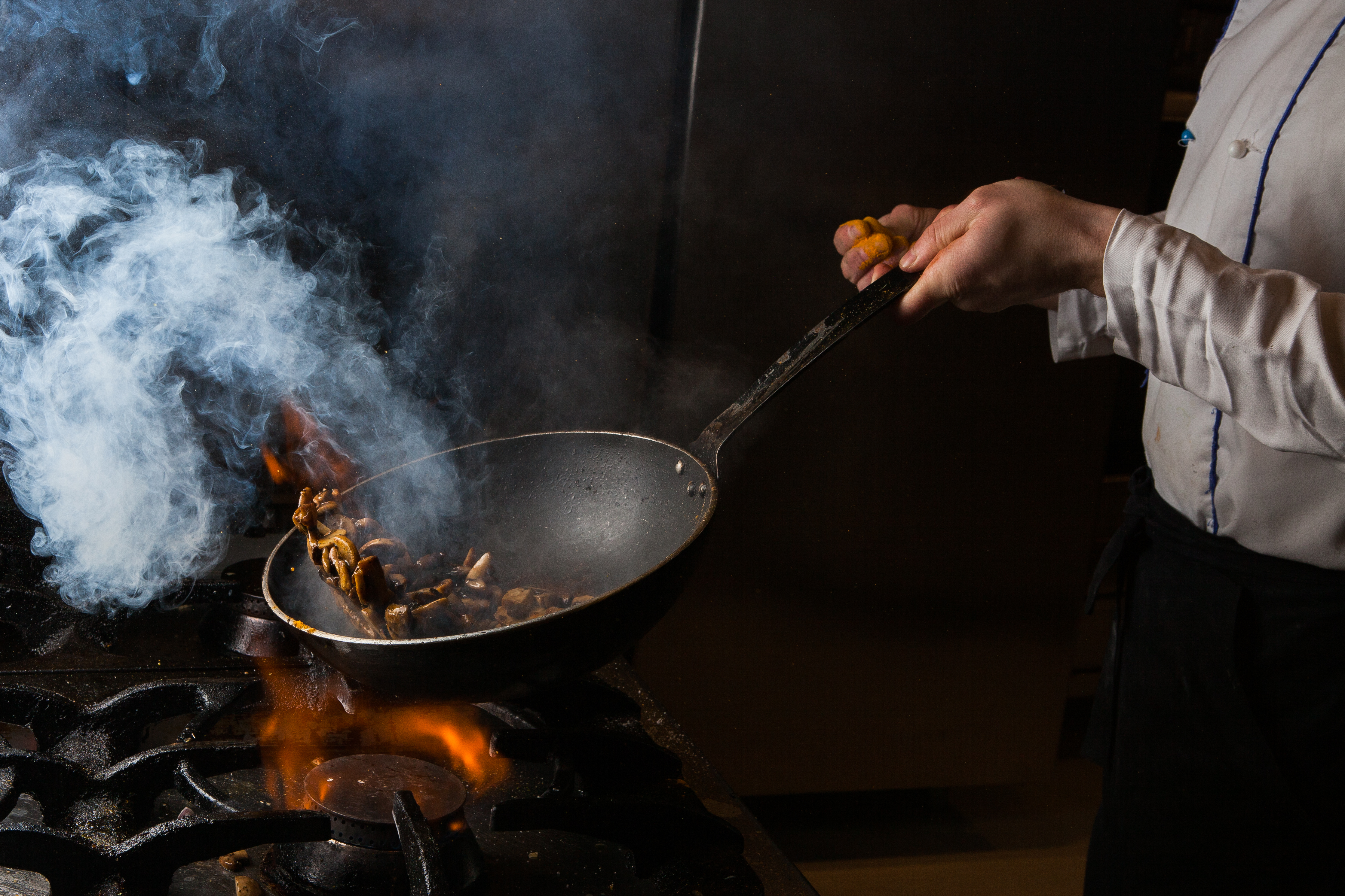 Chef cooking with fire