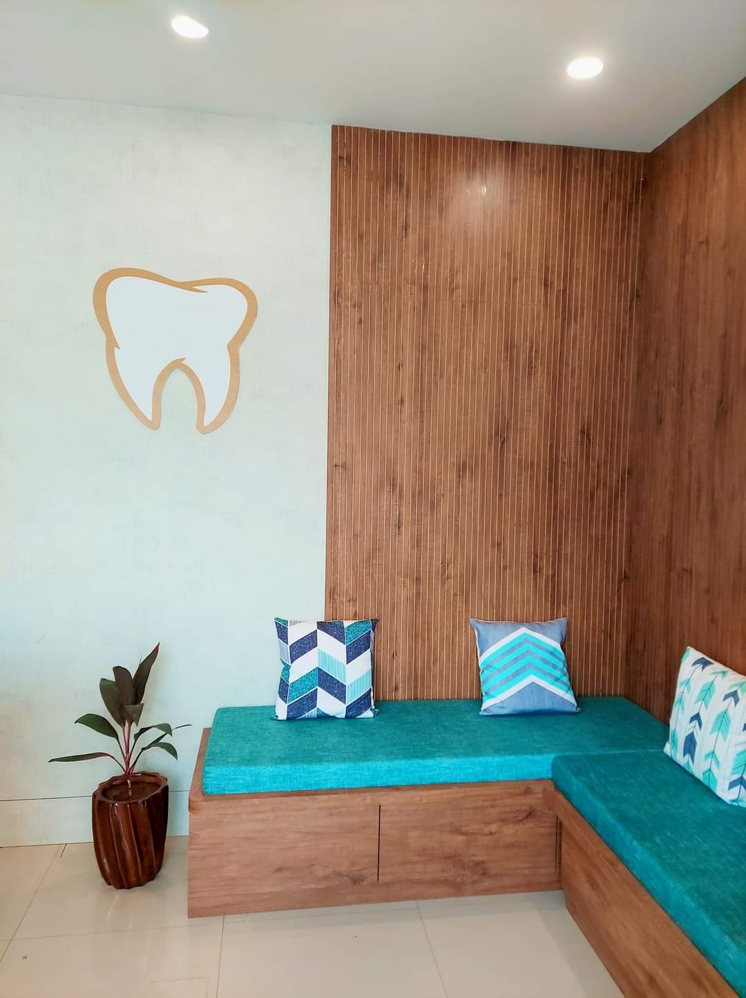 Shreemay Dental waiting area with tooth logo