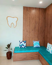 Shreemay Dental waiting area with tooth logo