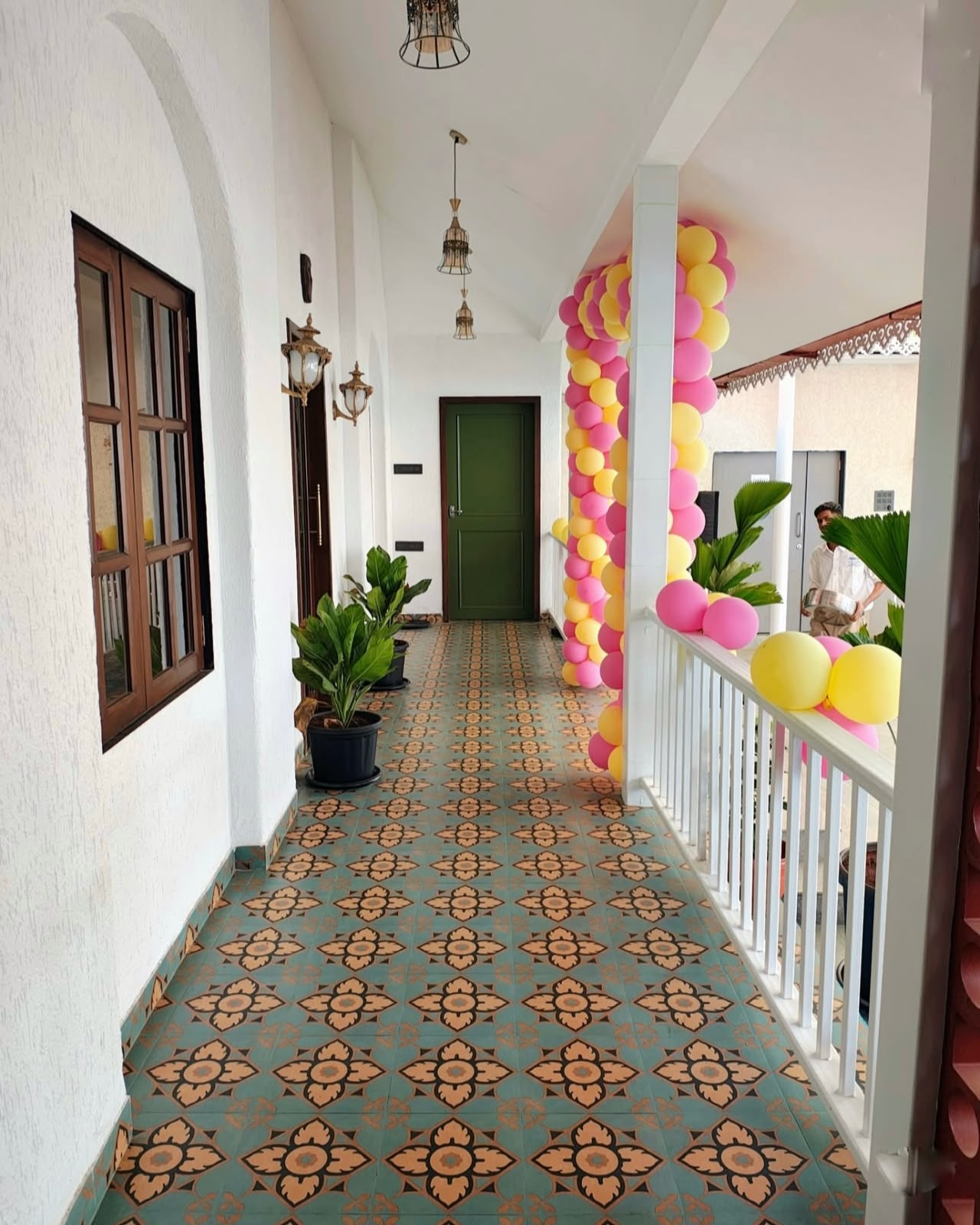 Portico entrance — Portuguese arches, turquoise balusters & signage dome