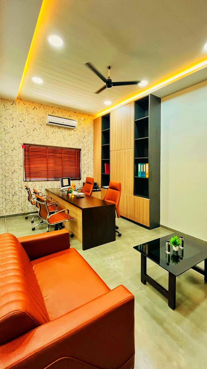 Executive cabin — wallpaper accent & tan leather seating