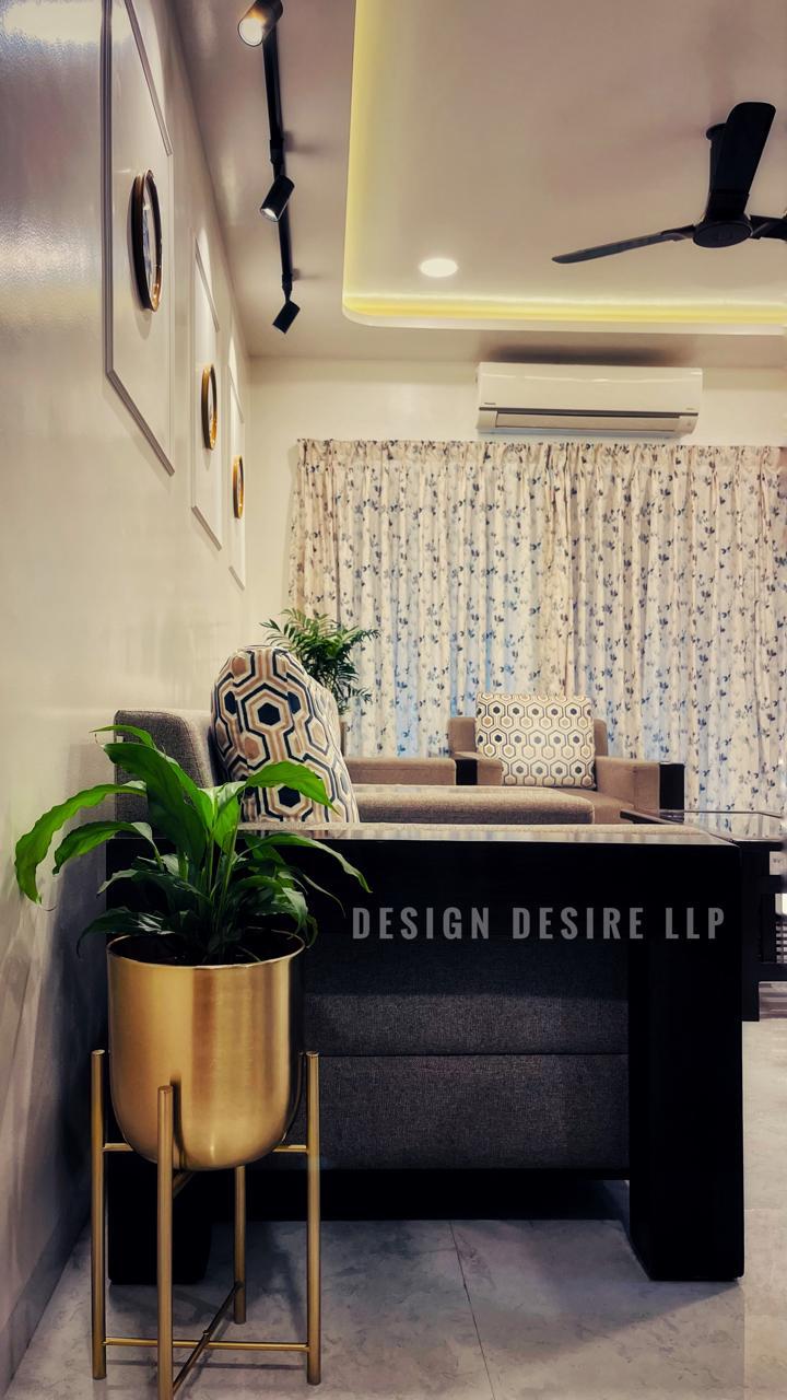 Living corridor at dusk — layered warm lighting & framed art