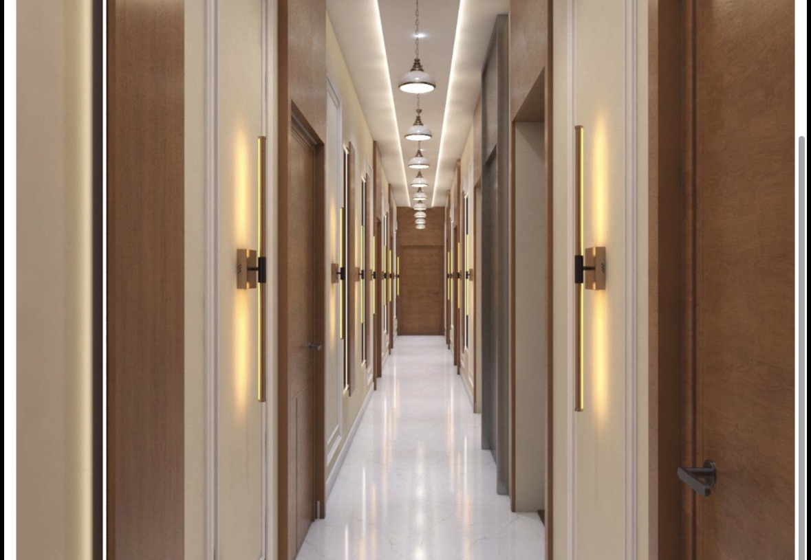 Guest corridor with linear brass lighting