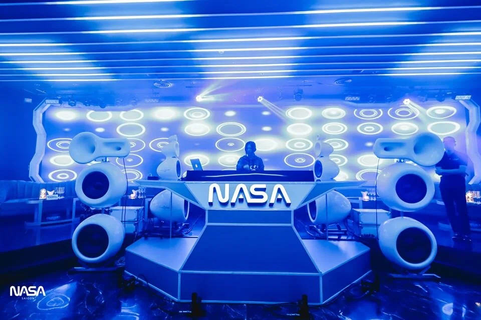 Blue lit DJ booth with NASA branding