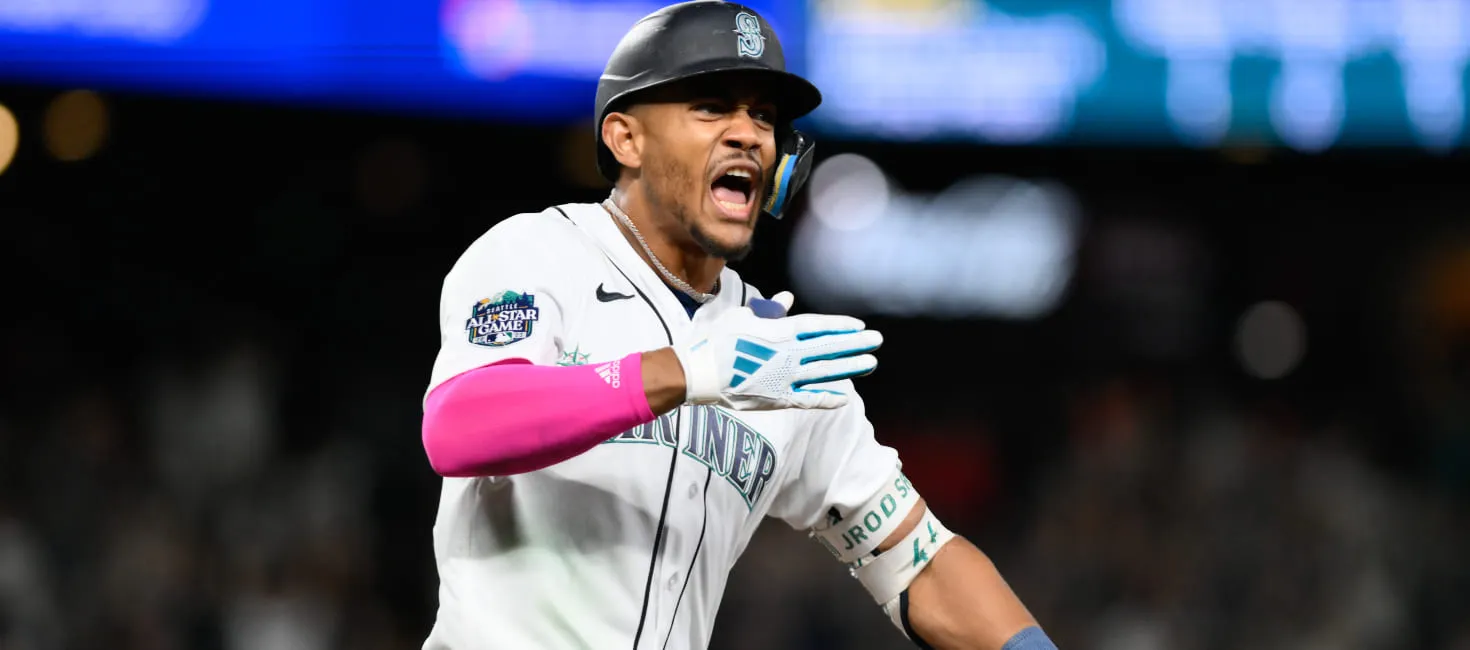 Seattle Mariners player Julio Rodriguez celebrating after a hit
