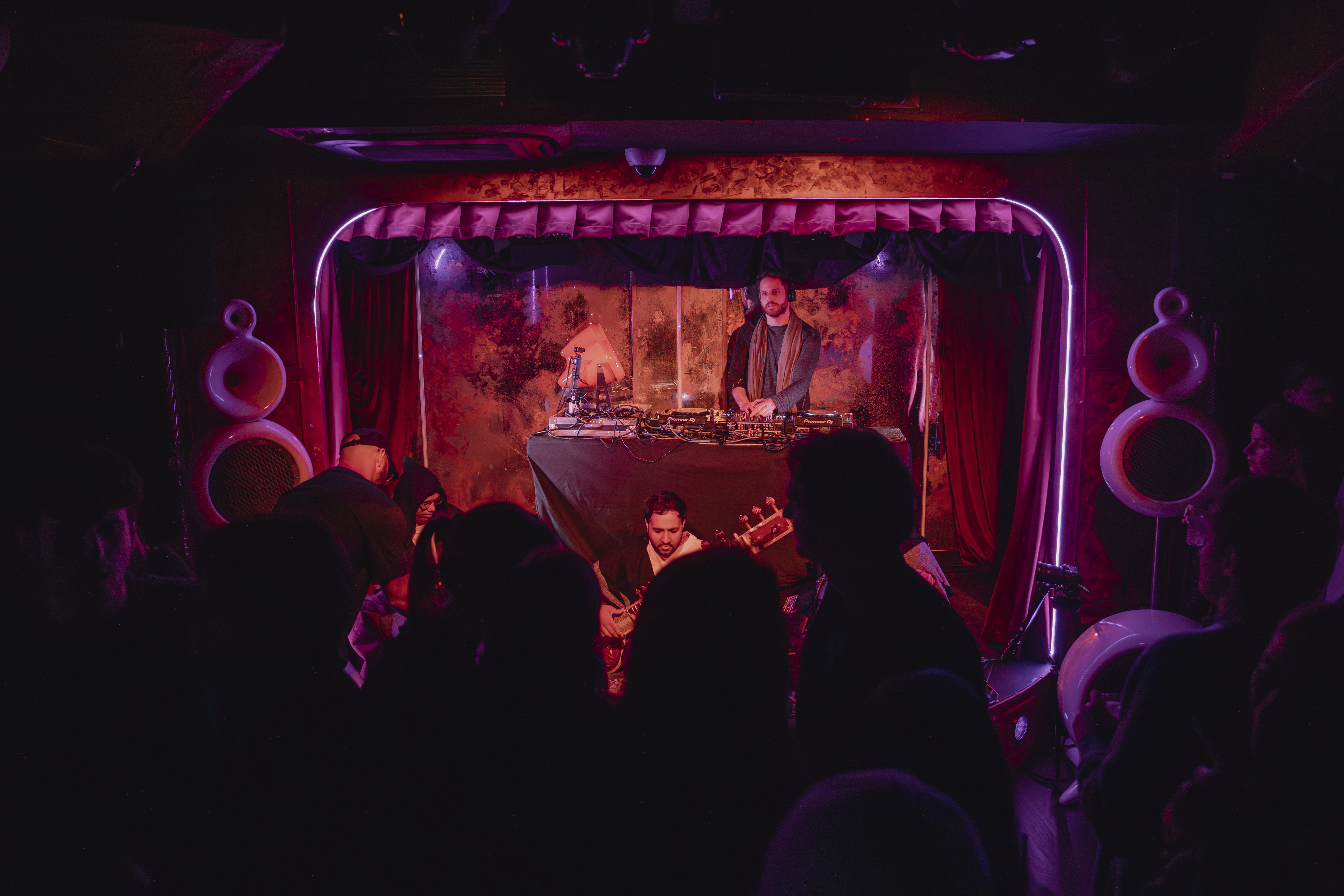 NAQ The Box DJ booth with crowd and Vesper speakers