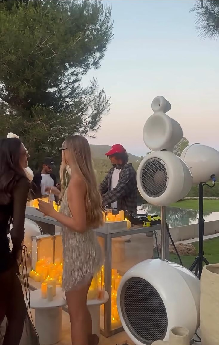 Outdoor sunset party with Kona speakers and DJ