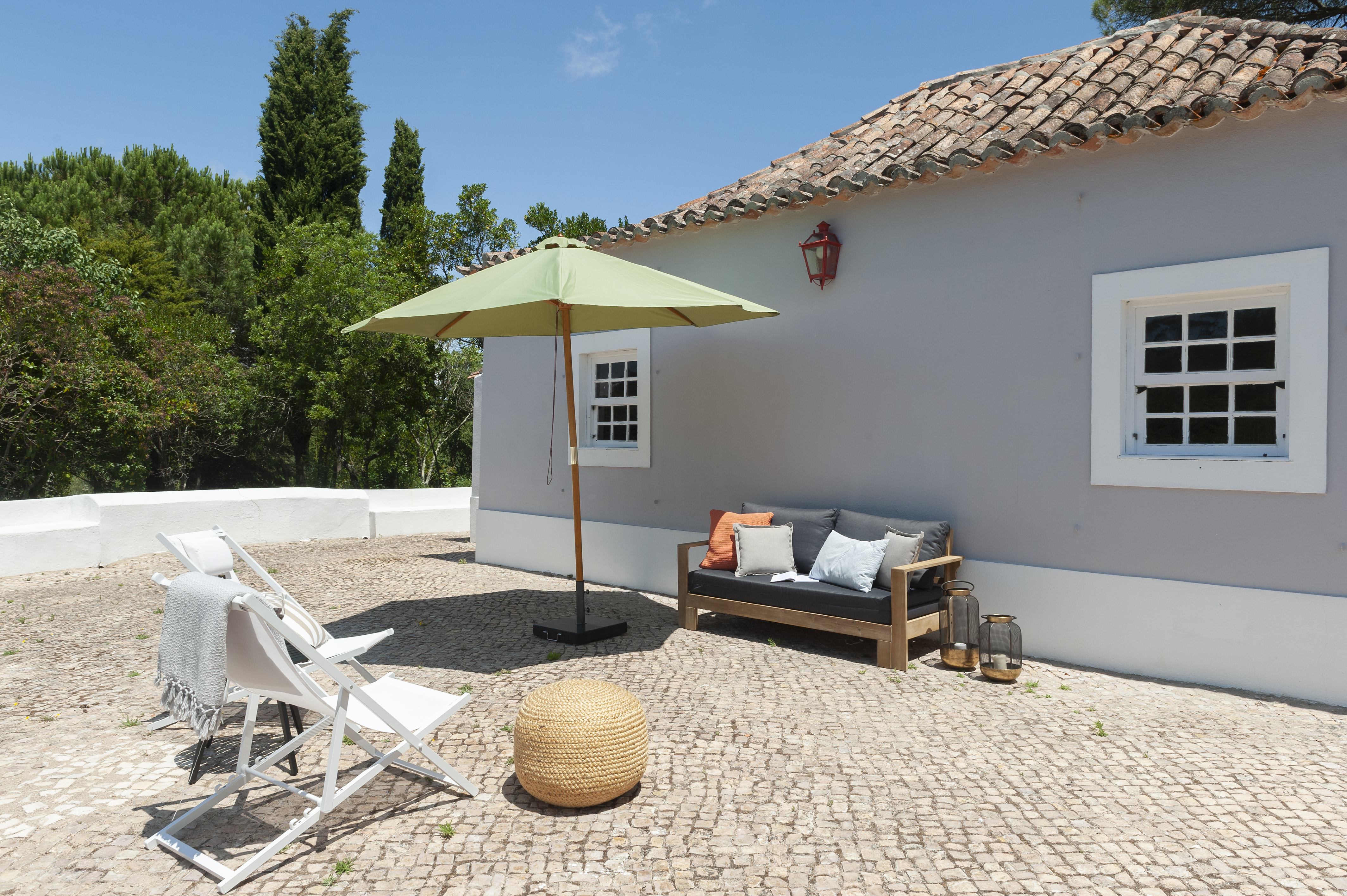 Pine Tree House exterior with seating area