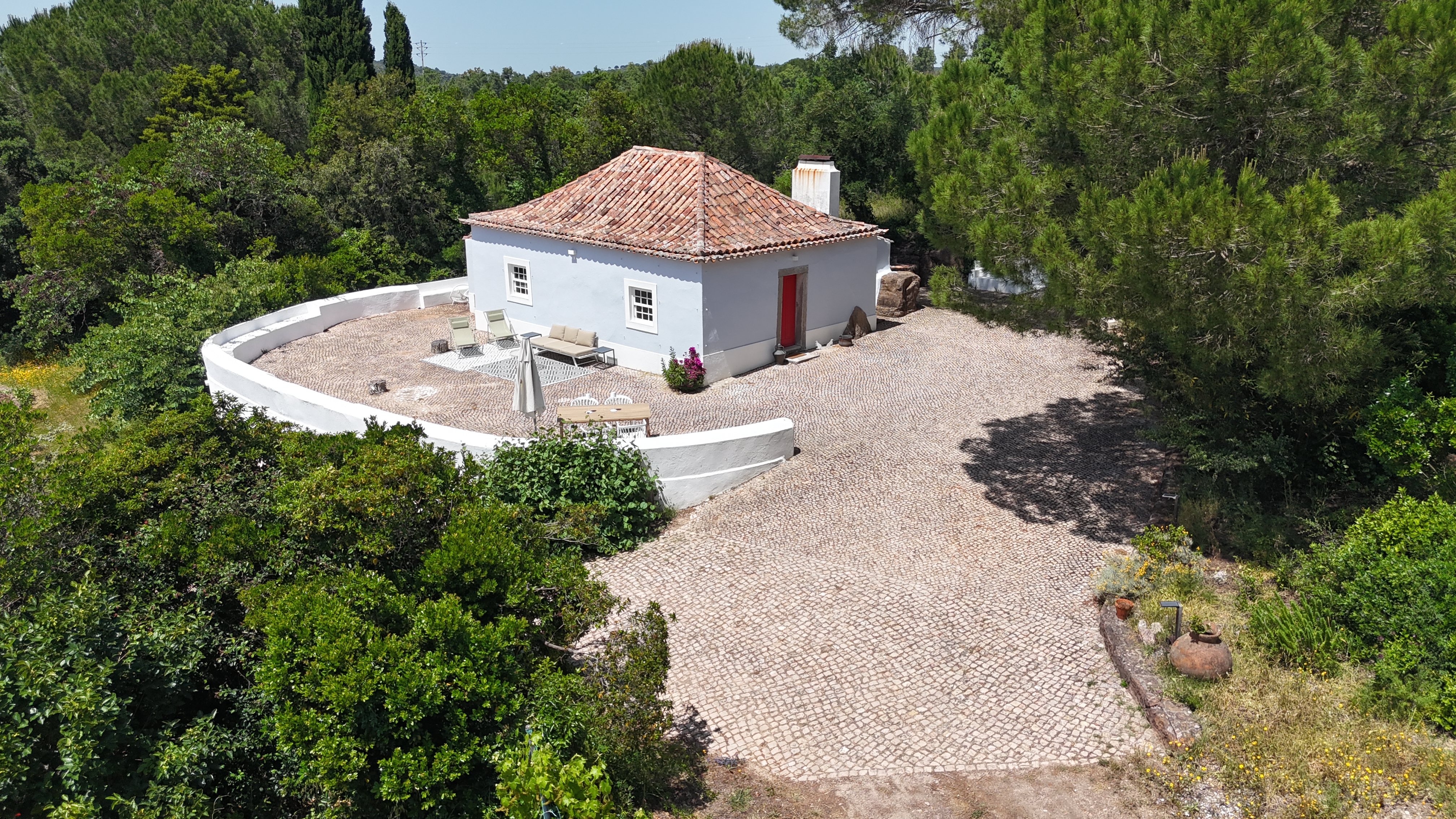 Pine Tree House aerial view showing terrace and red door