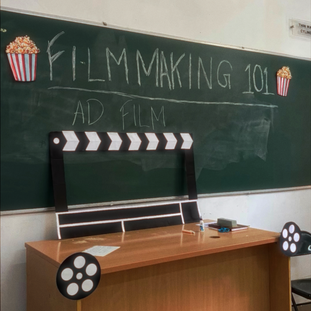 Filmmaking 101 - Ad Film classroom setup with chalkboard and clapperboard