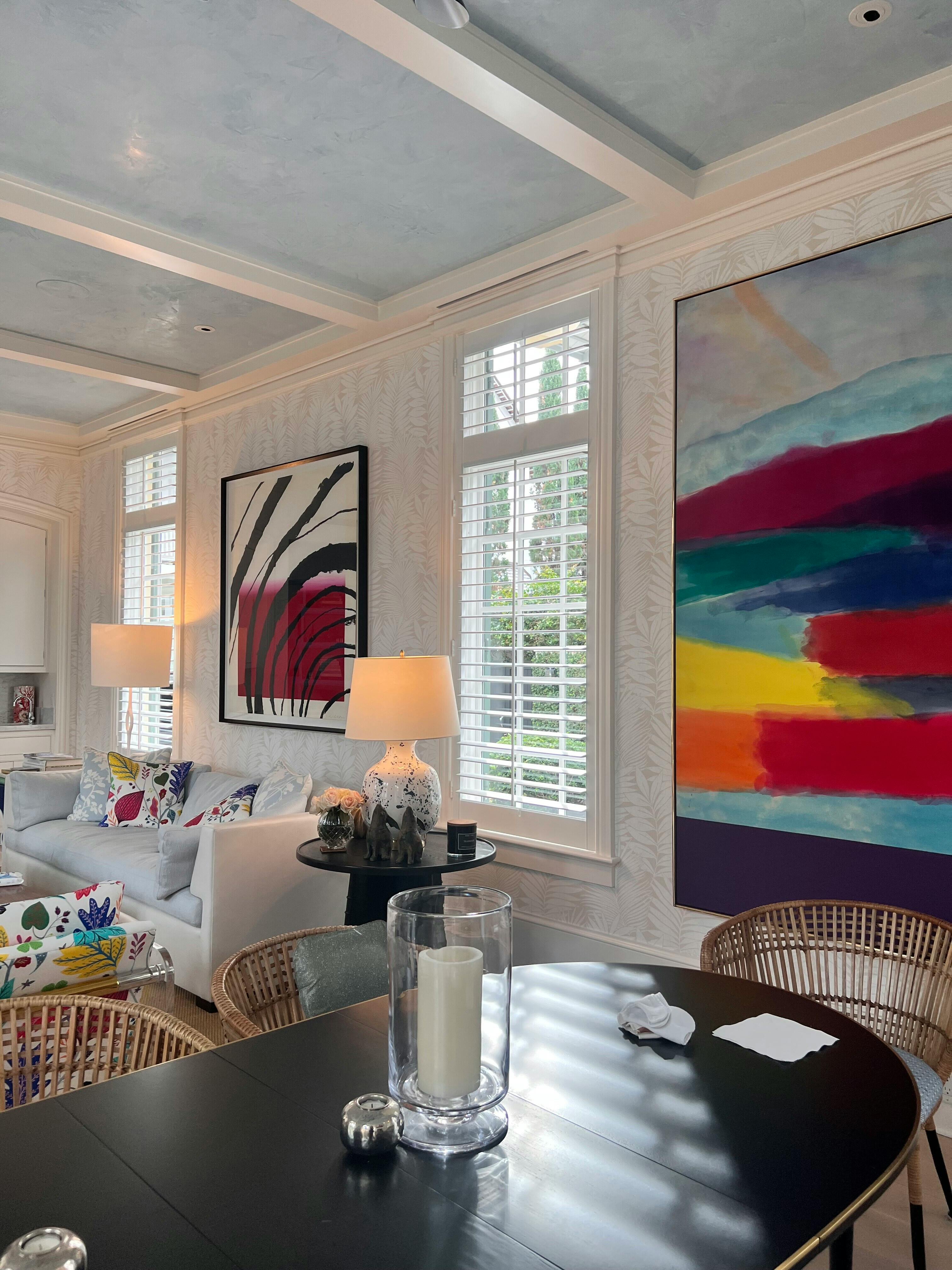 Stylish living room with custom ceiling and artwork