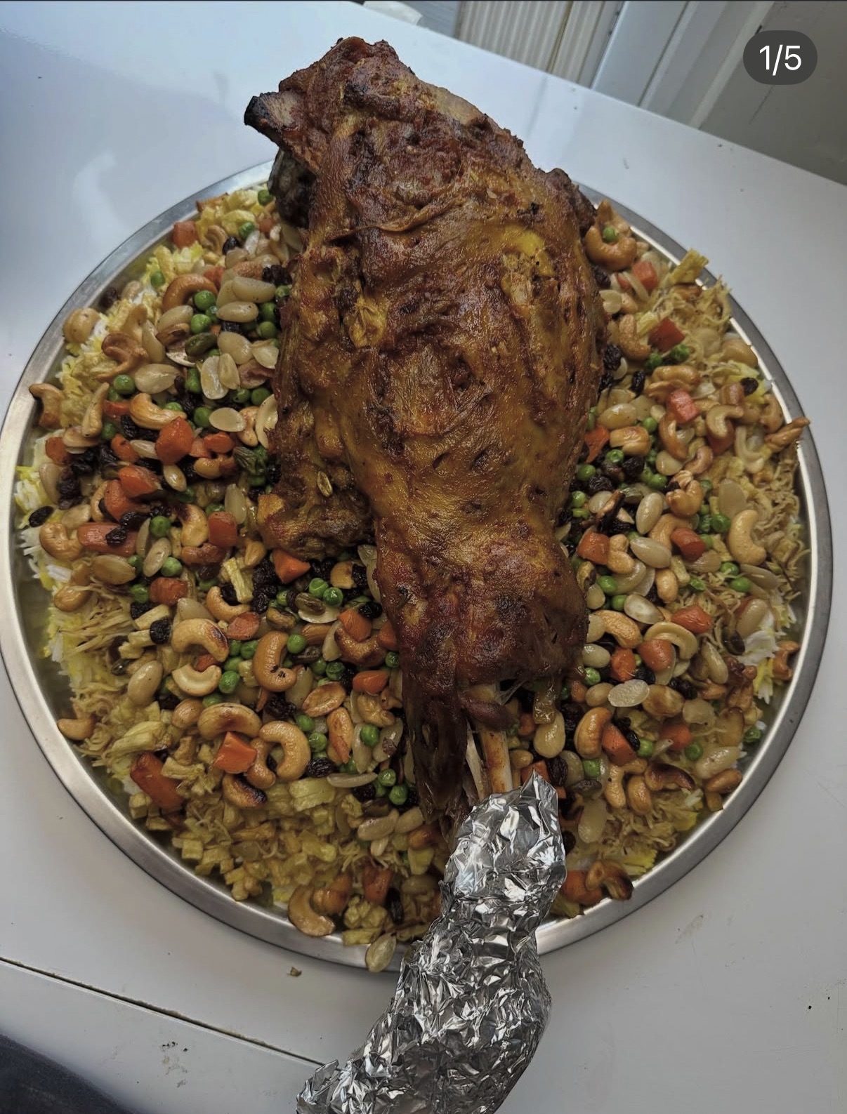 A generous Iraqi Qoozi feast of lamb over spiced rice