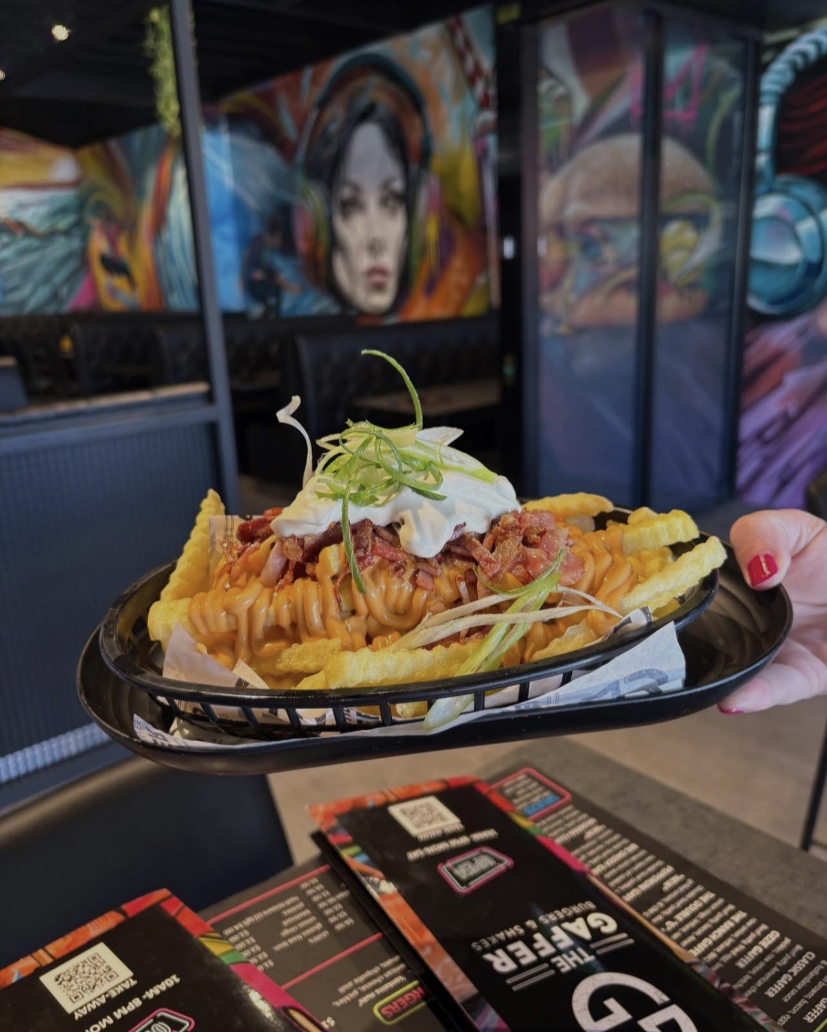 Loaded fries with bacon, cheese sauce and spring onion