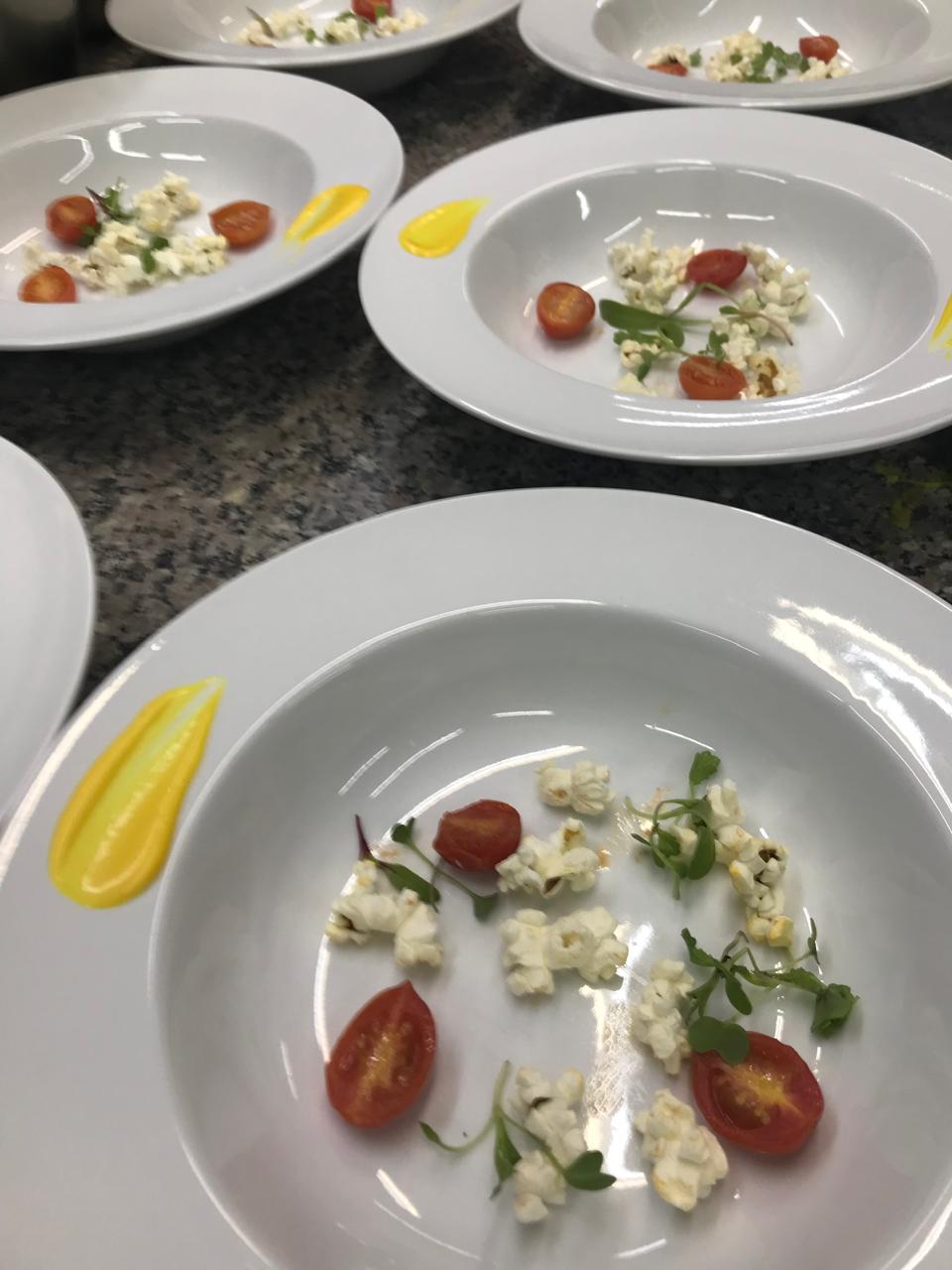 Minimalist tomato and popcorn plates