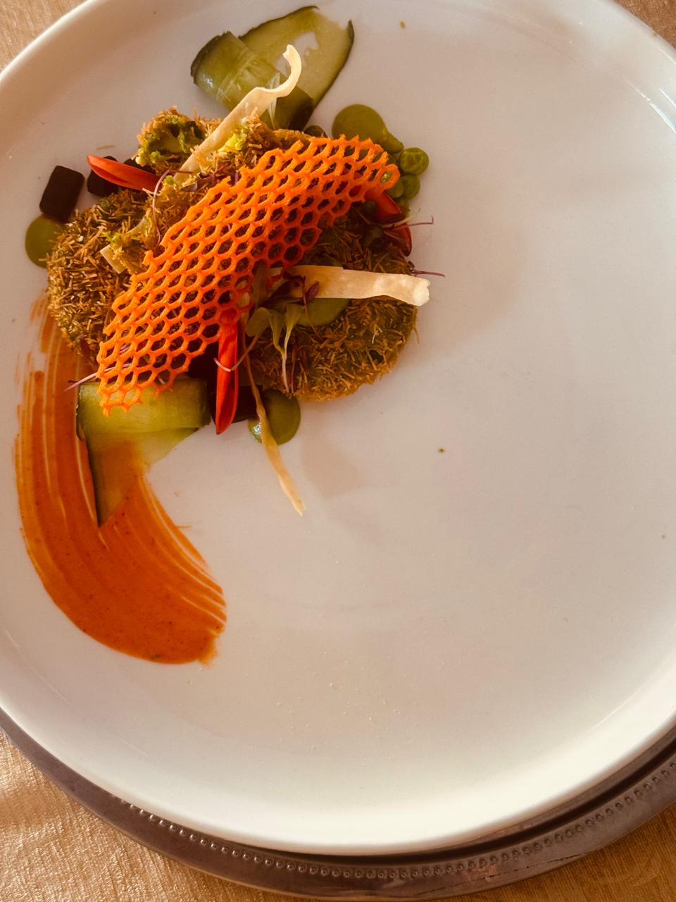 Artistic plated dish with honeycomb garnish