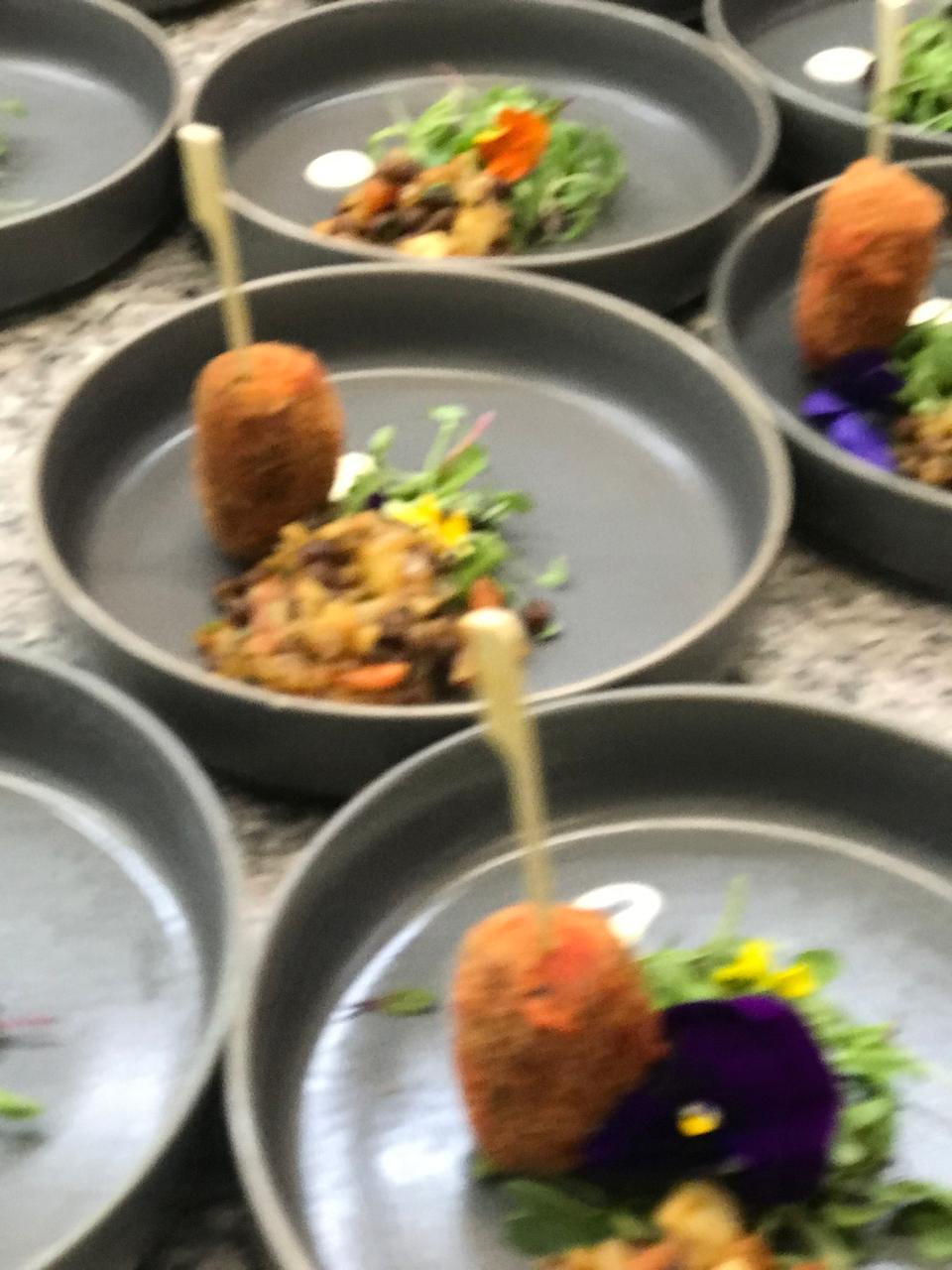 Plated appetizers with edible flowers
