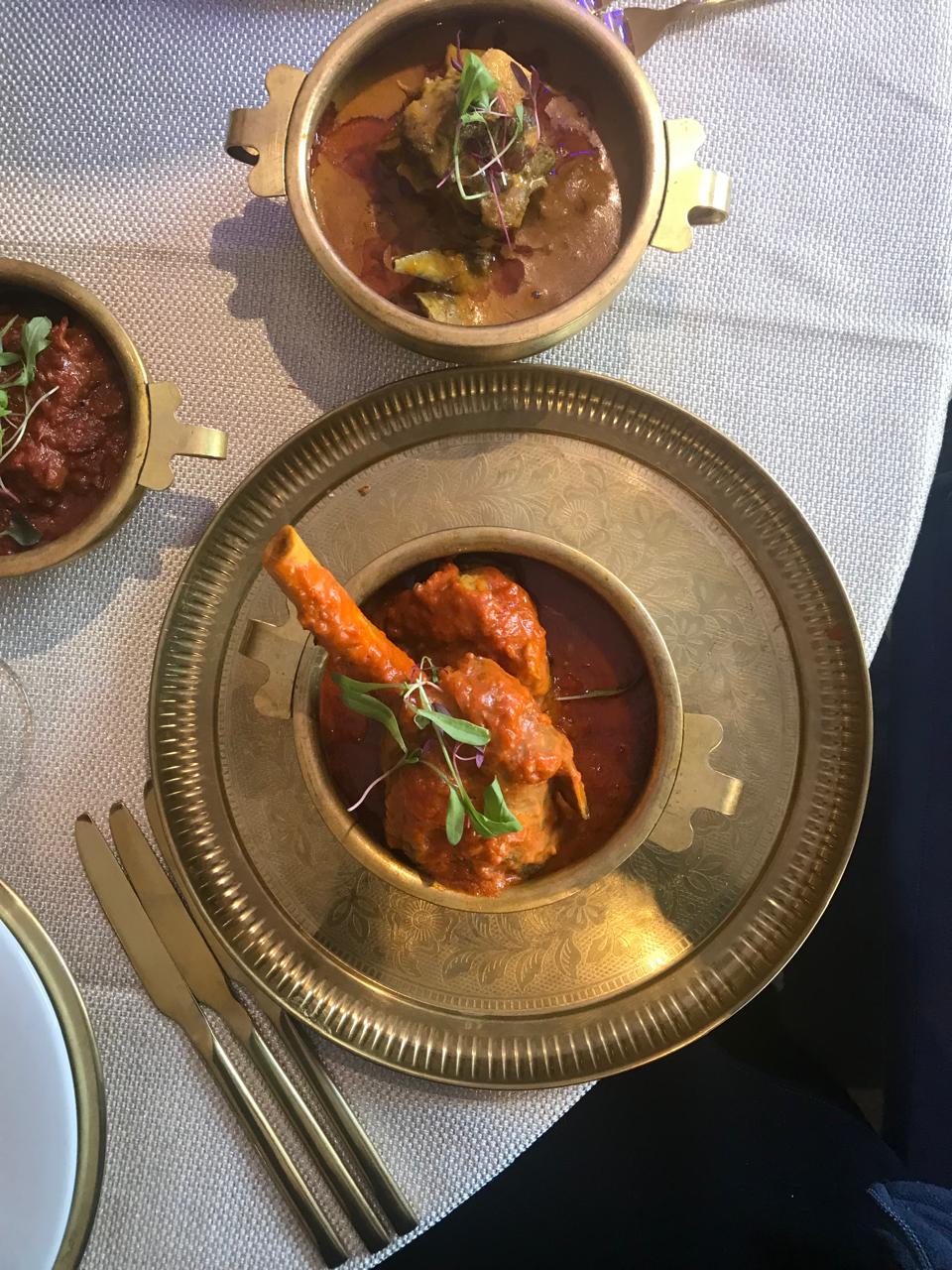 Lamb shank in brass bowl