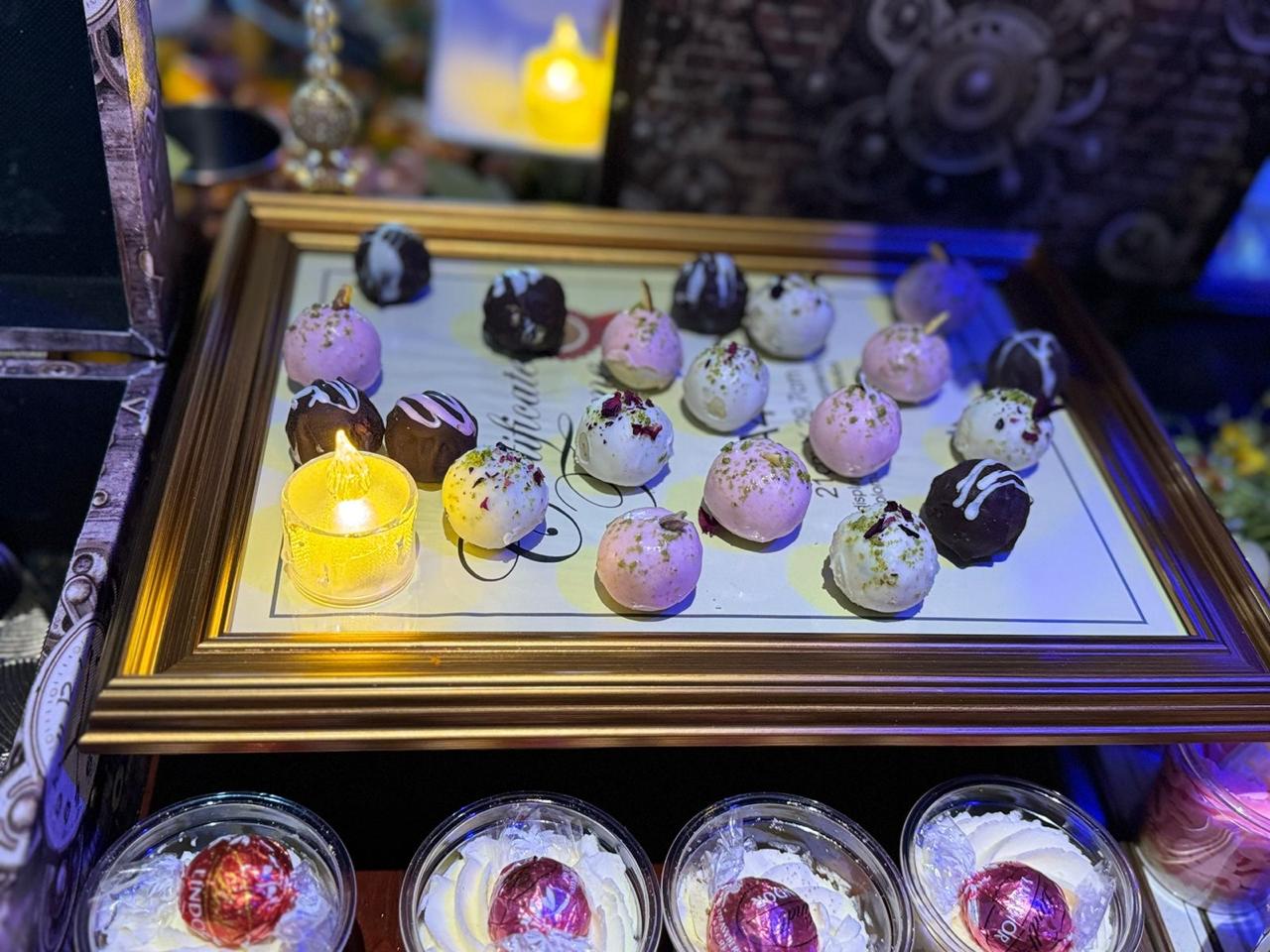 Artisan truffles on gold frame