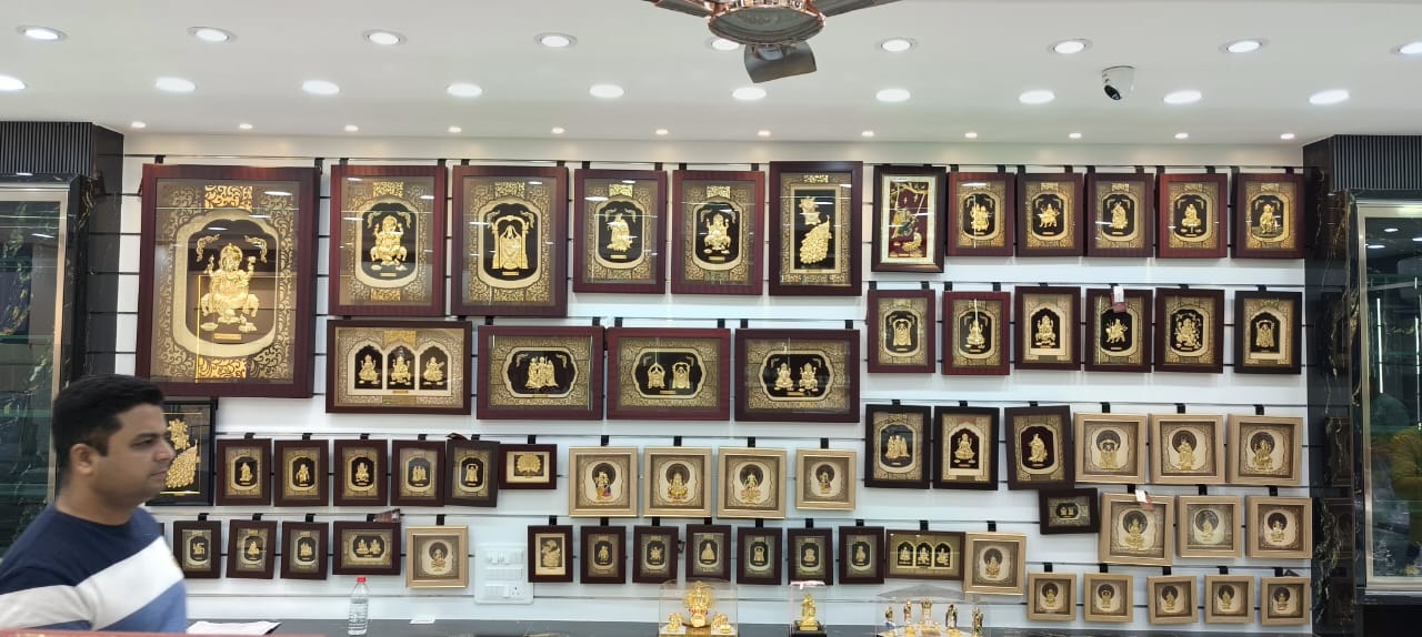 Wall display of Aarya24KT gold foil art collection