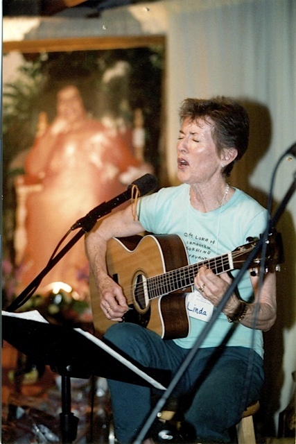 Linda D. Gallagher playing guitar