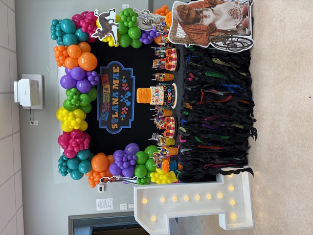 Hem of Grace Events birthday dessert table balloon garland Florida party planner