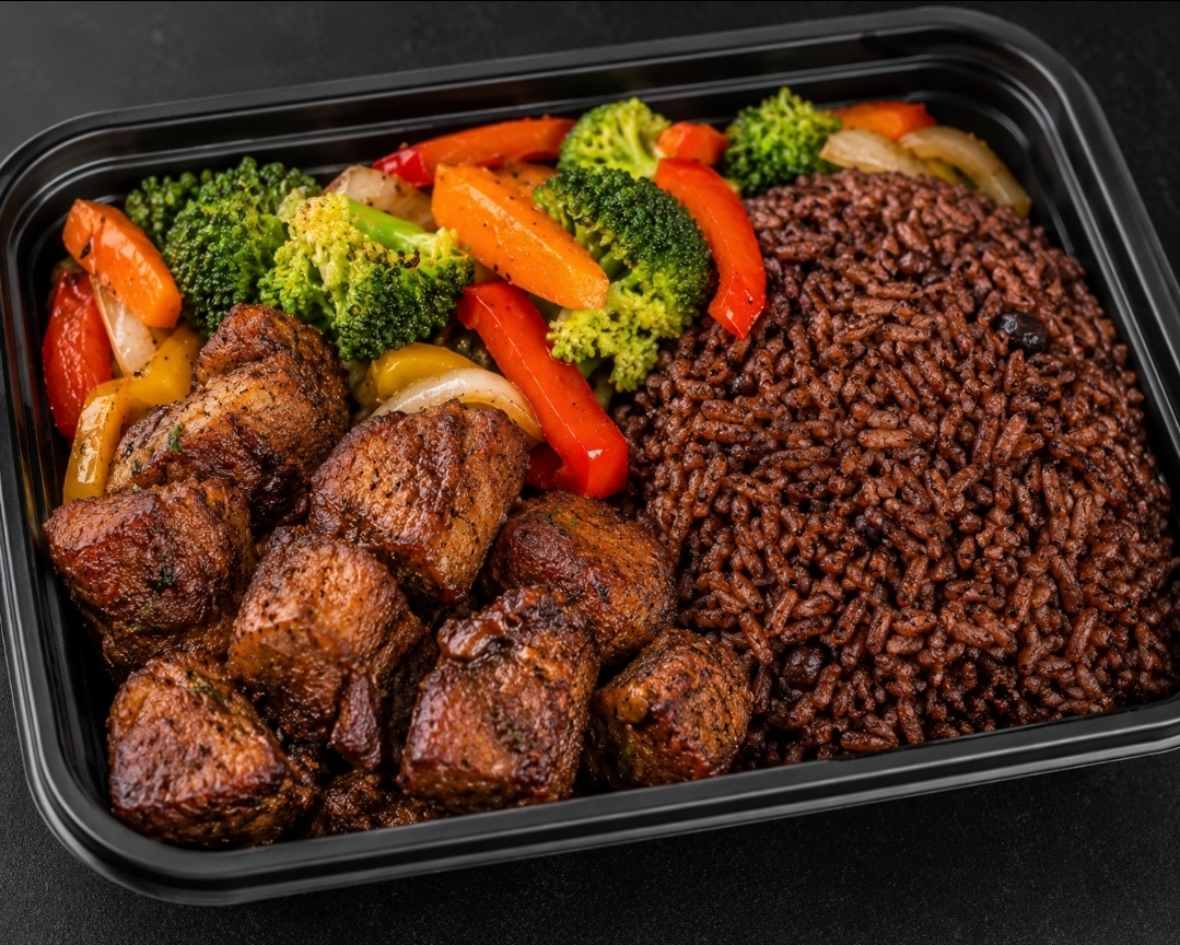 Caribbean Meal Prep — baked pork with Haitian diri djon djon black rice and mixed vegetables