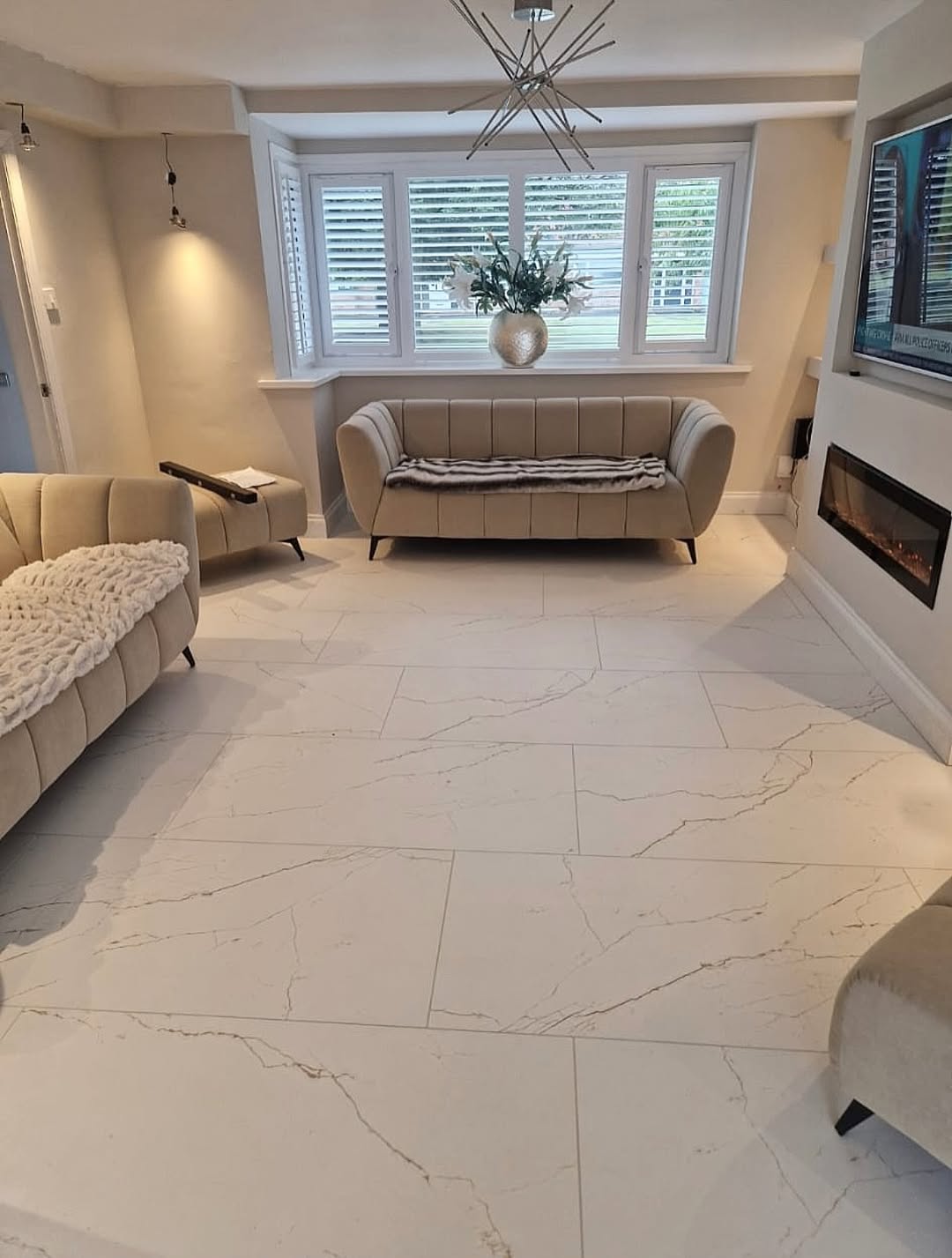 M&L Exterior and Interior Design — Premium marble-look tile flooring in luxury living room
